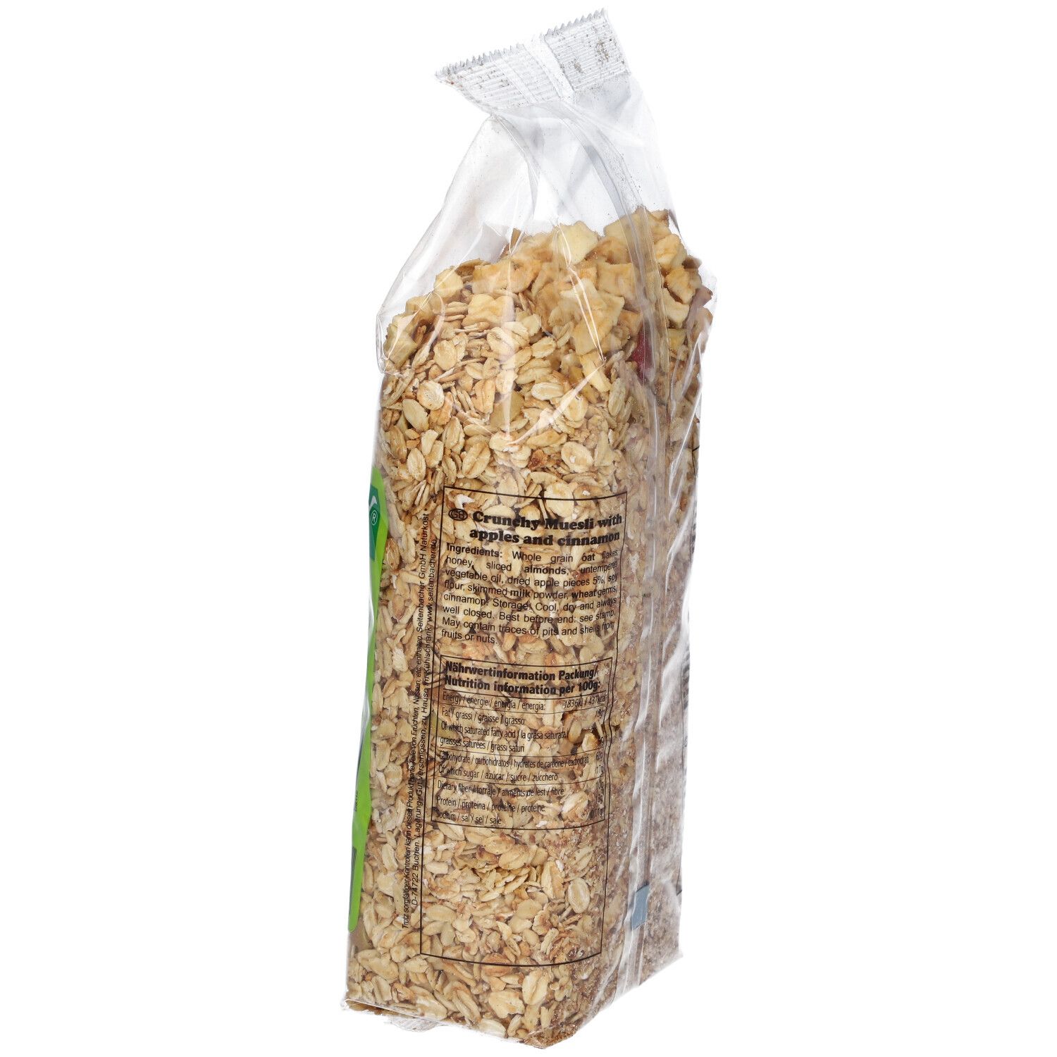 Vue latérale d'un sachet transparent de muesli pomme-cannelle. Informations textuelles sur l'étiquette.