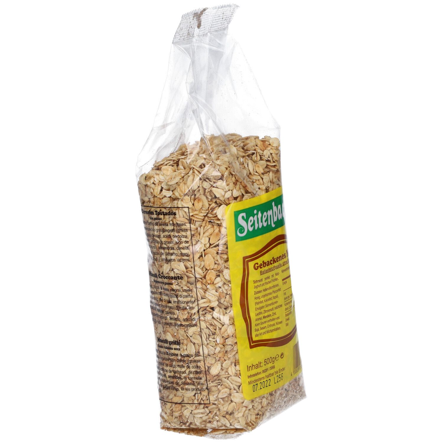 Muesli Gebackenes Seitenbacher dans un sachet transparent. Étiquette jaune avec informations produit. Vue latérale.