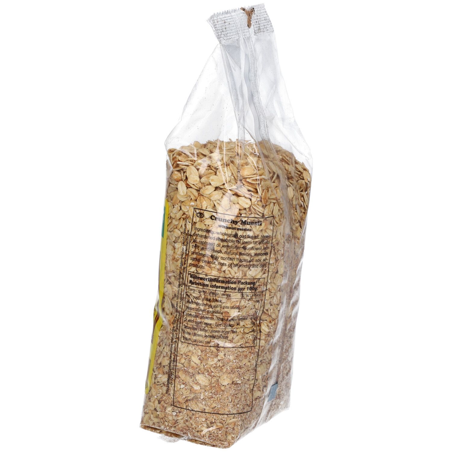 Vue latérale d'un sachet transparent de Muesli Gebackenes. Étiquette jaune avec texte. Dos.