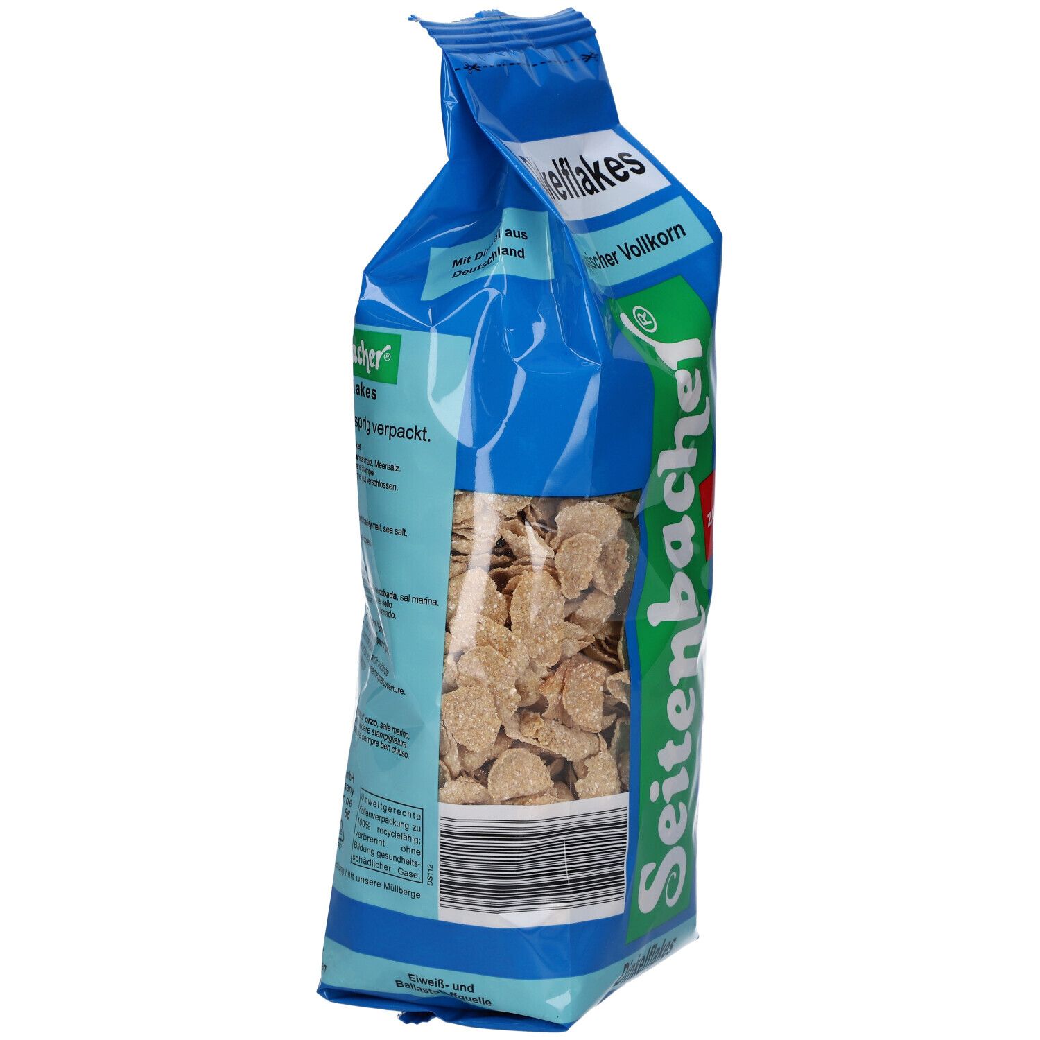 Vue latérale du paquet de Dinkelflakes. Sac bleu avec nom et logo du produit. Film partiellement transparent.