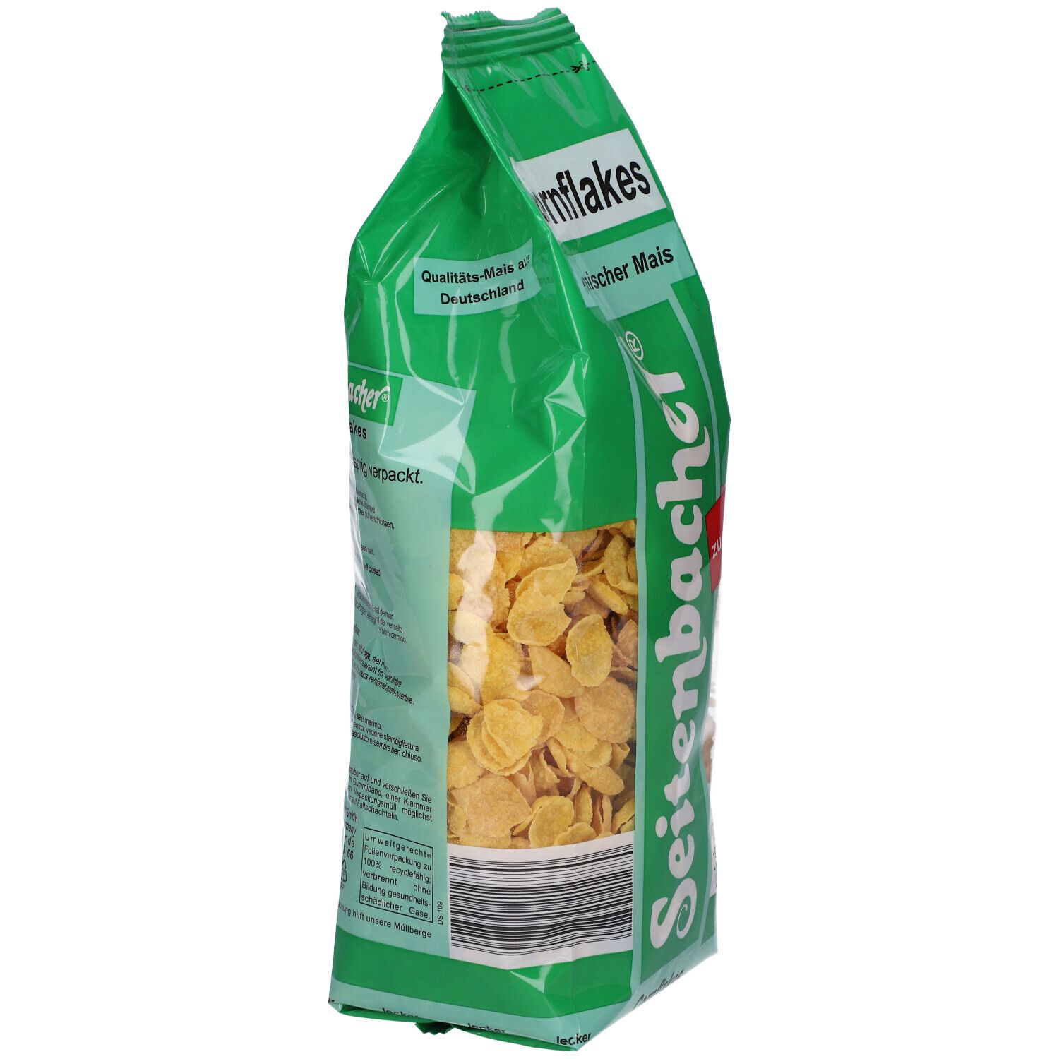 Côté du paquet de Cornflakes Seitenbacher. Emballage vert avec céréales. Inscription : Cornflakes, maïs local.