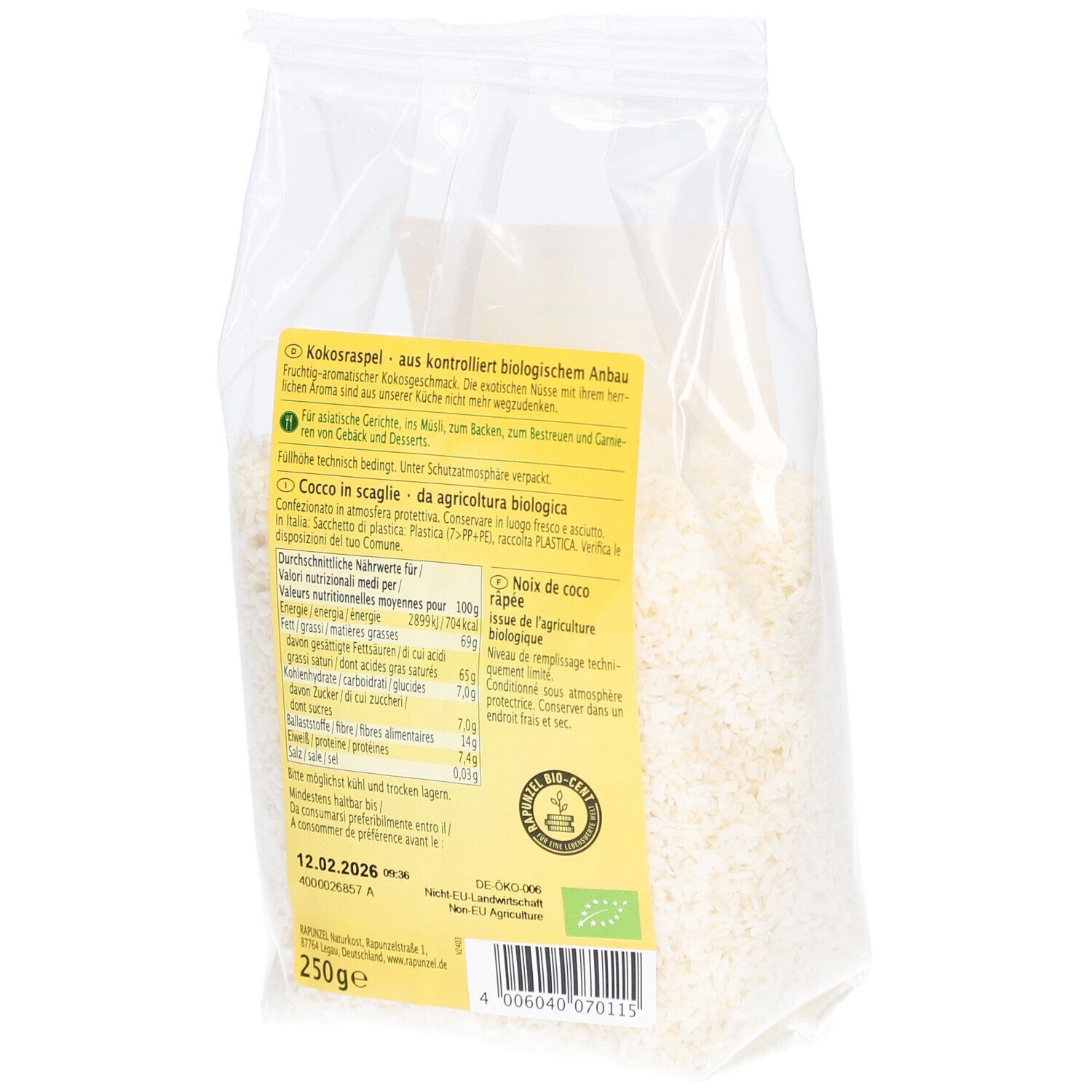 Dos d'un sachet transparent de copeaux de noix de coco. Étiquette avec informations sur le produit et valeurs nutritionnelles. Label bio.