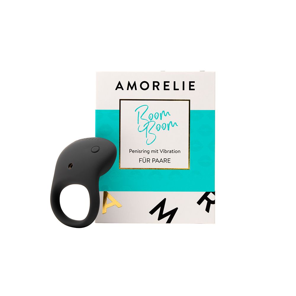 Anneau pénien gris avec vibration et boutons. Emballage avec logo AMORELIE et nom du produit.