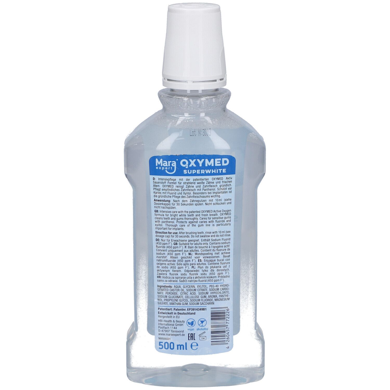 Dos de la bouteille de bain de bouche OXYMED. Bouteille transparente avec liquide bleu. Bouchon blanc. Étiquette avec texte et ingrédients. 500 ml.