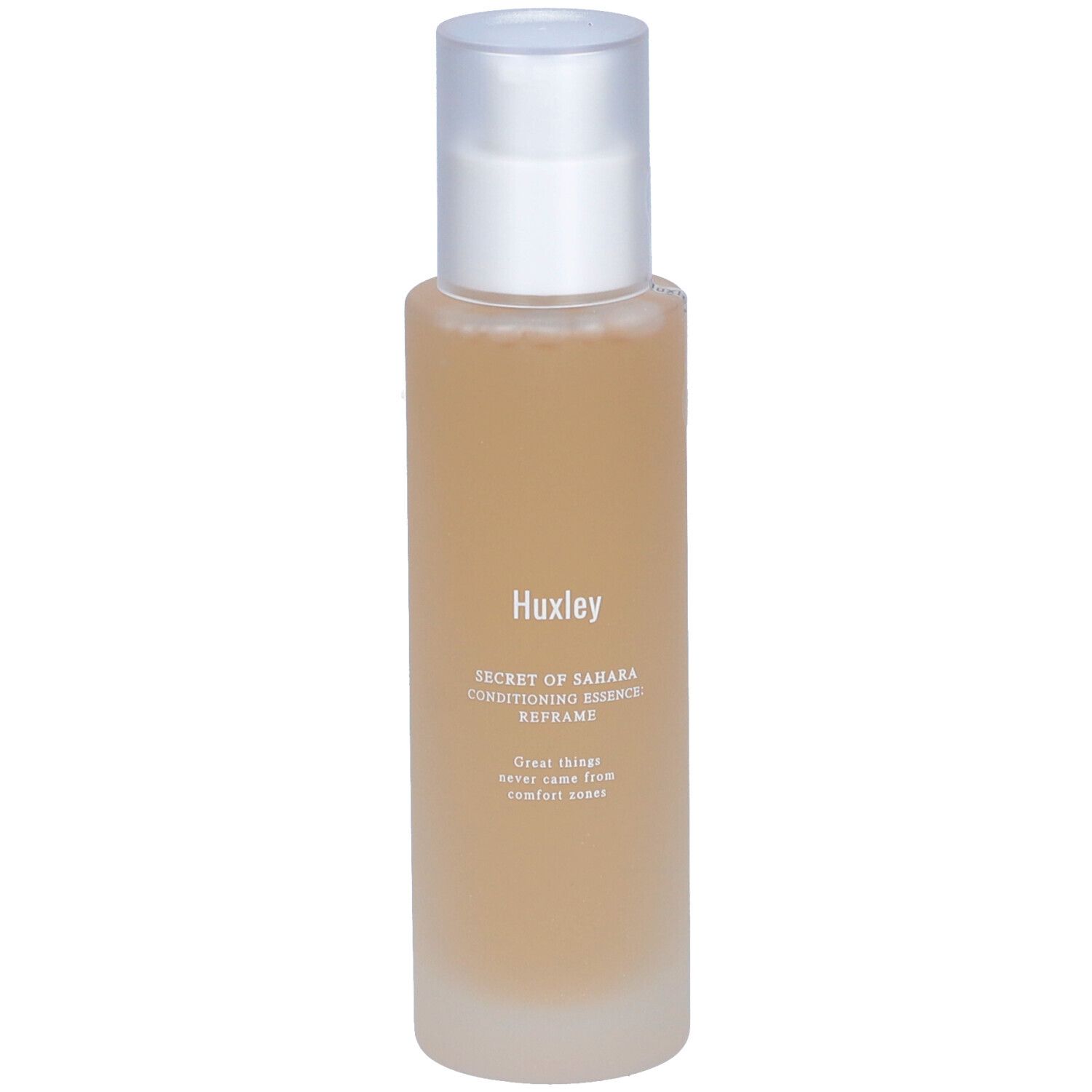 Flacon cylindrique avec contenu transparent et bouchon argenté. Inscription: Huxley Secret of Sahara Conditioning Essence Reframe.