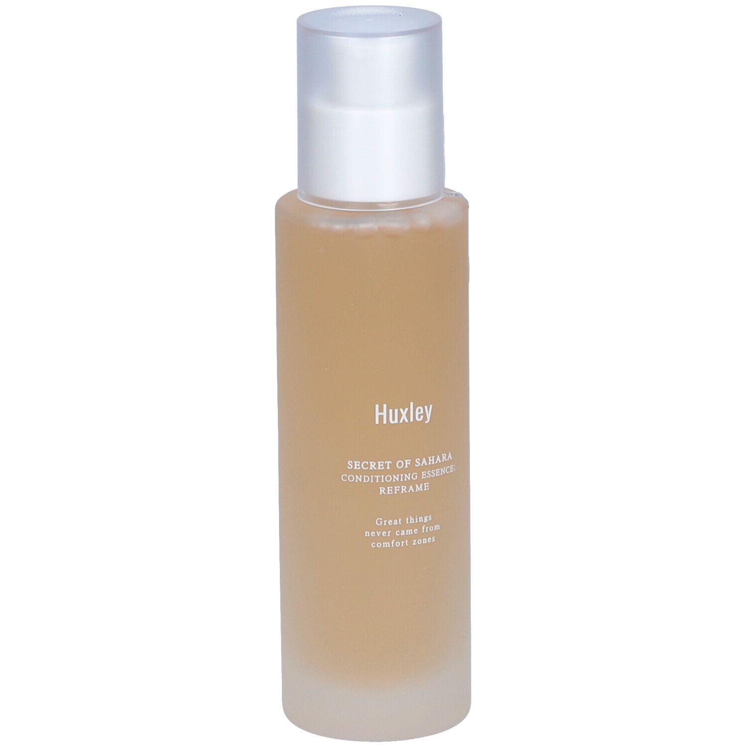 Flacon cylindrique avec contenu transparent et bouchon argenté. Inscription: Huxley Secret of Sahara Conditioning Essence Reframe.