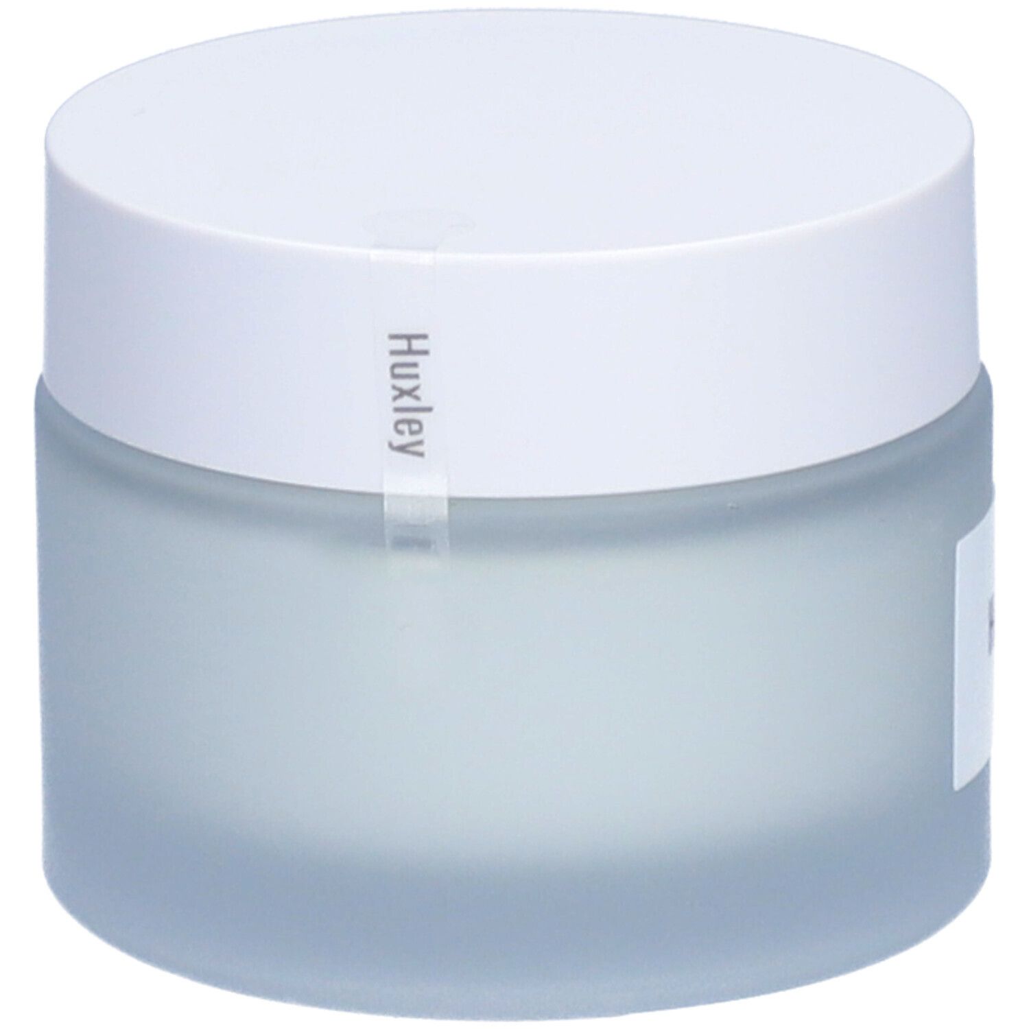 Pot de crème avec couvercle blanc. Étiquette avec 'Huxley'.