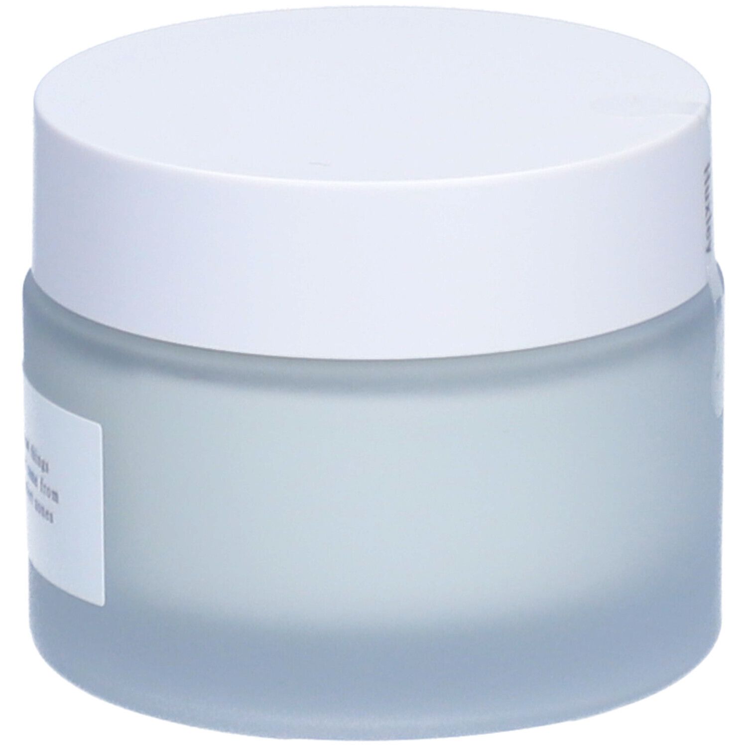 Pot de crème avec couvercle blanc. Étiquette avec informations produit.
