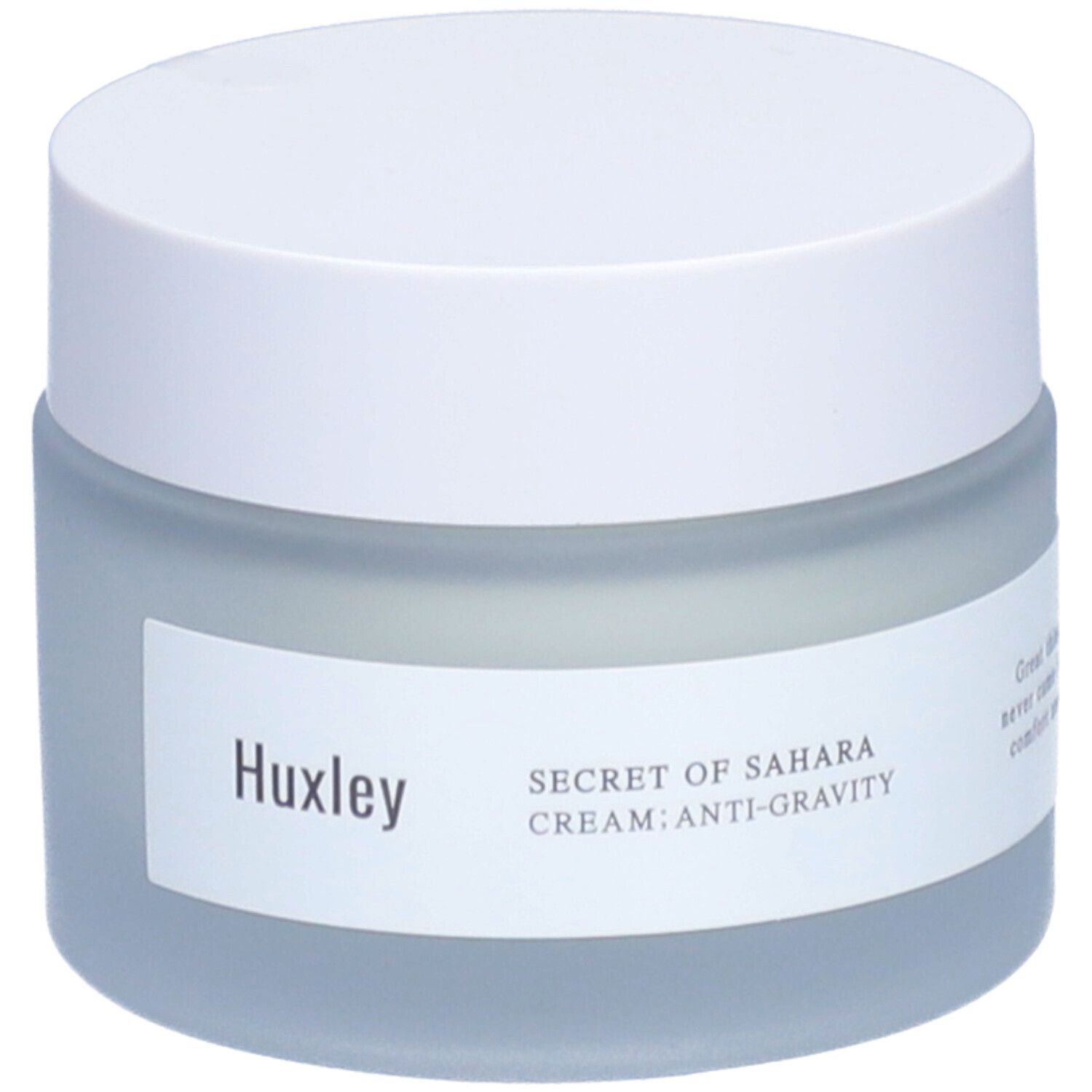 Pot de crème avec couvercle blanc. Étiquette avec 'Huxley' et 'Secret of Sahara Cream: Anti-Gravity'.