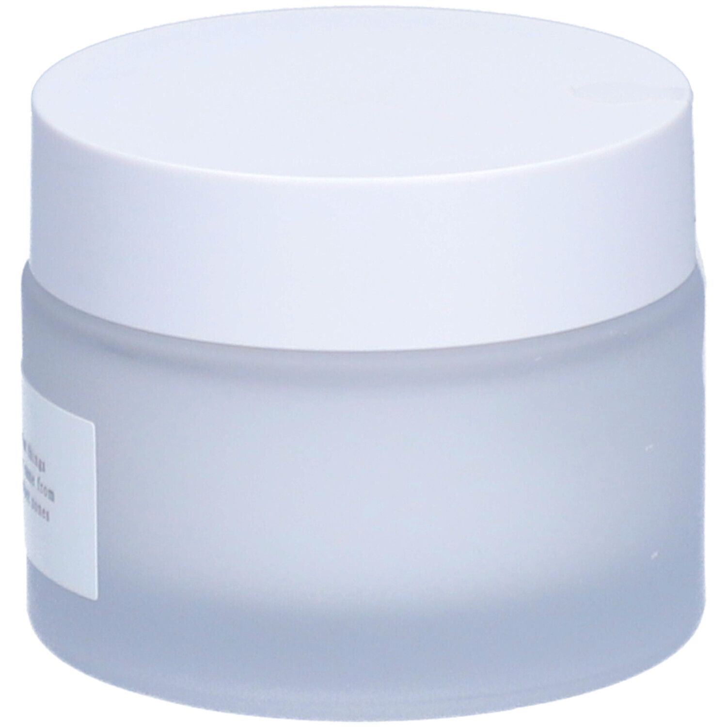 Pot de crème avec couvercle blanc. Le pot est laiteux. Texte sur l'étiquette.