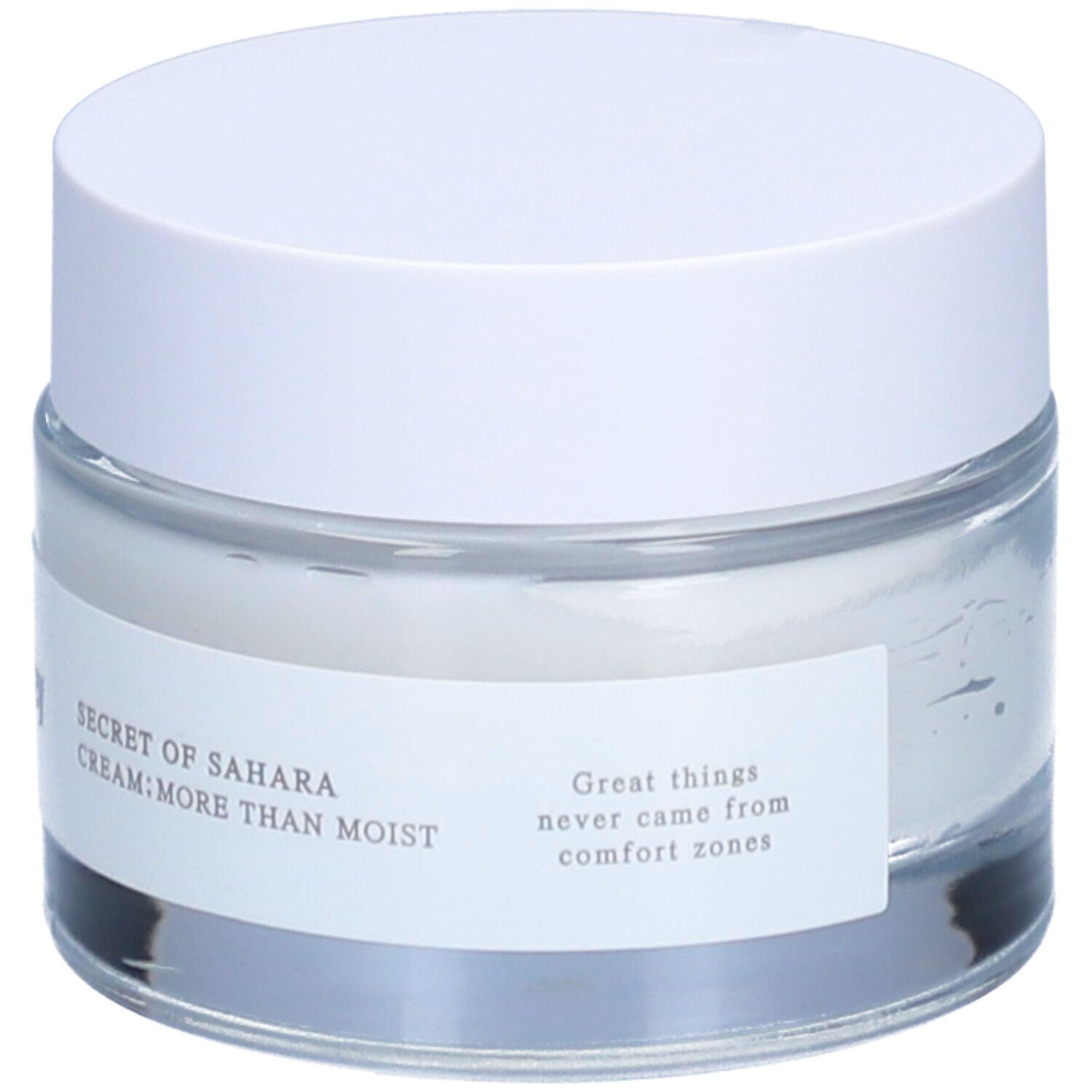 Pot de crème avec couvercle blanc. L'étiquette indique "SECRET OF SAHARA CREAM; MORE THAN MOIST".