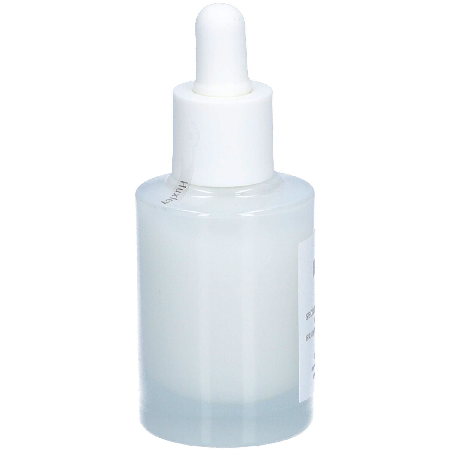 Flacon blanc avec pipette. Étiquette "Huxley" et nom du produit. Vue latérale.