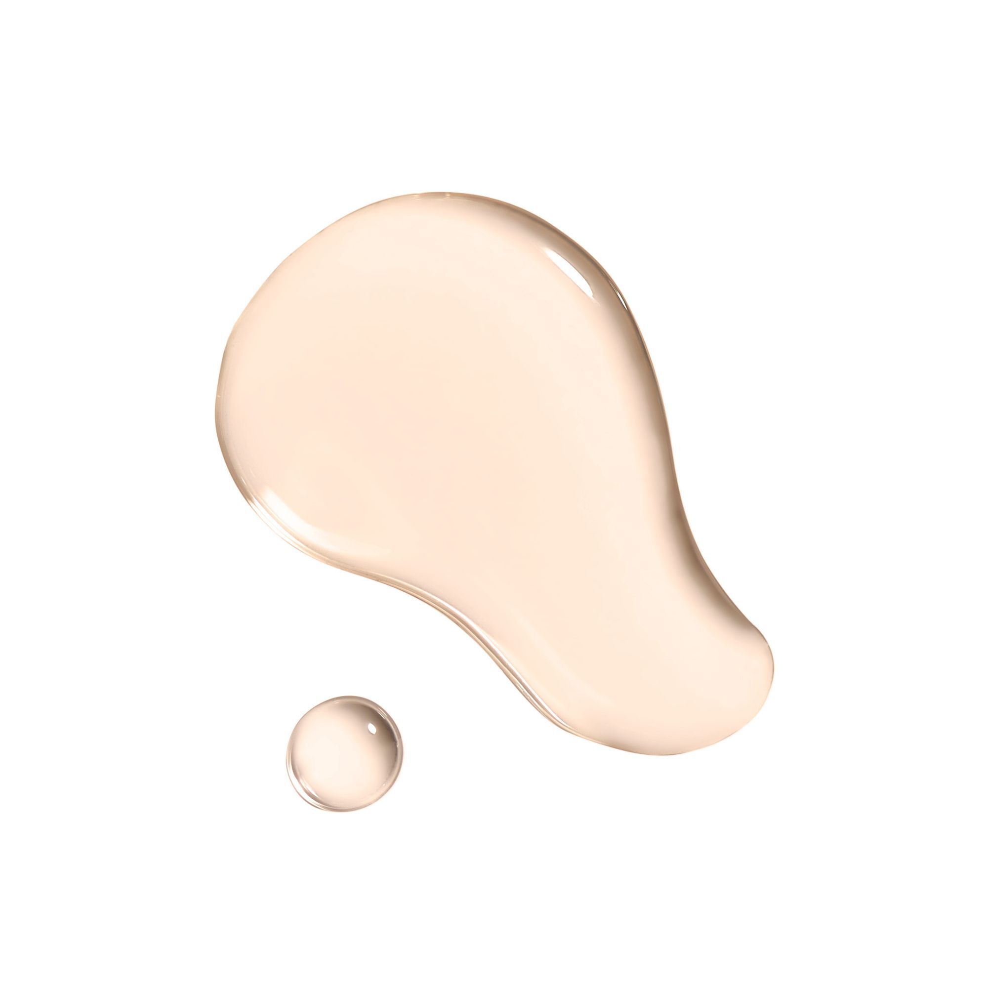 Gouttes de liquide. Brun clair, brillant. Petite goutte à côté. Sur fond blanc.