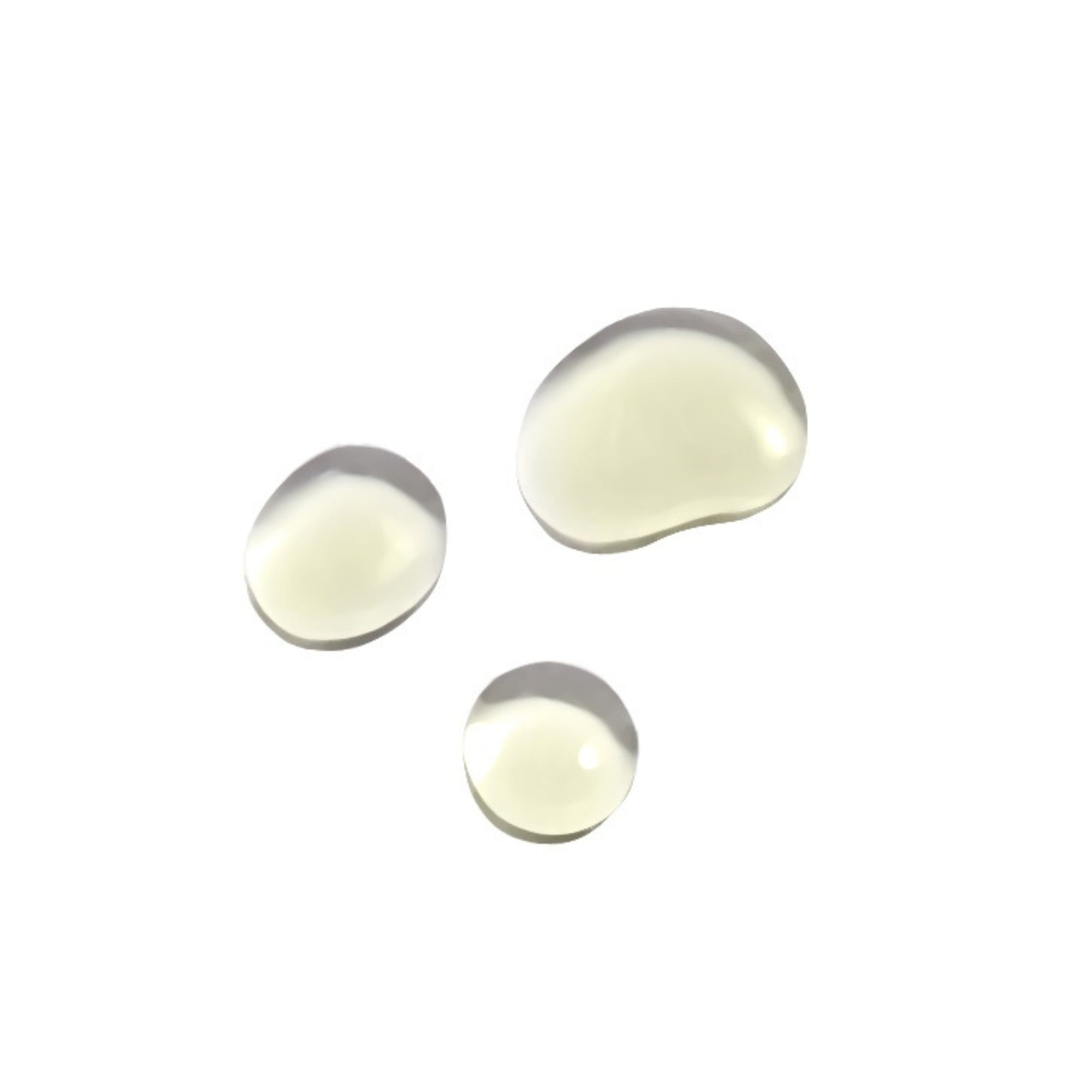 Trois gouttes d'huile pour le visage. Gouttes rondes jaune clair sur fond blanc.