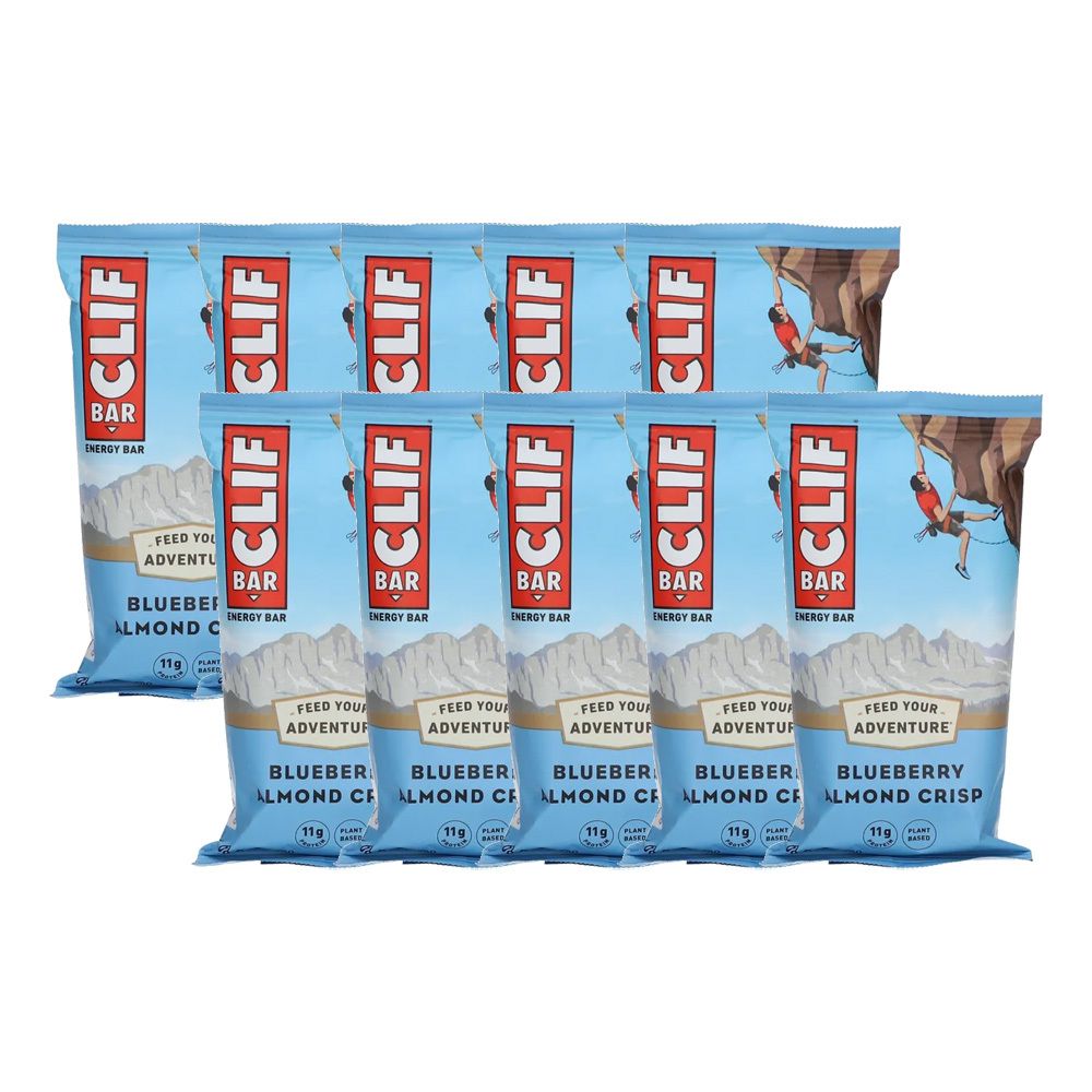 Plusieurs barres énergétiques CLIF Bar, Blueberry Crisp. Emballage bleu avec illustration d'alpiniste. Texte: CLIF BAR, Blueberry Almond Crisp.