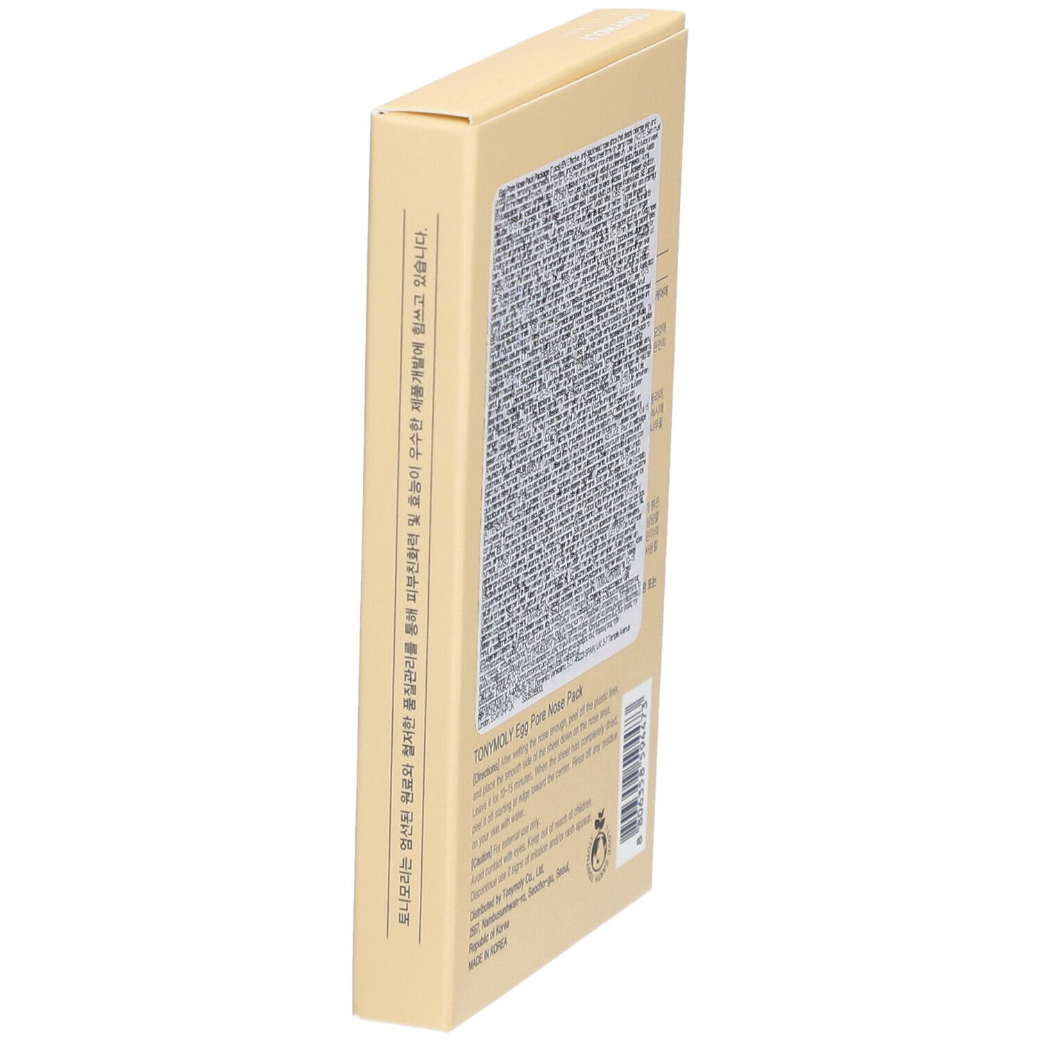 Boîte beige inclinée avec texte. 'TONYMOLY Egg Pore Nose Pack'. Instructions et ingrédients en plusieurs langues.