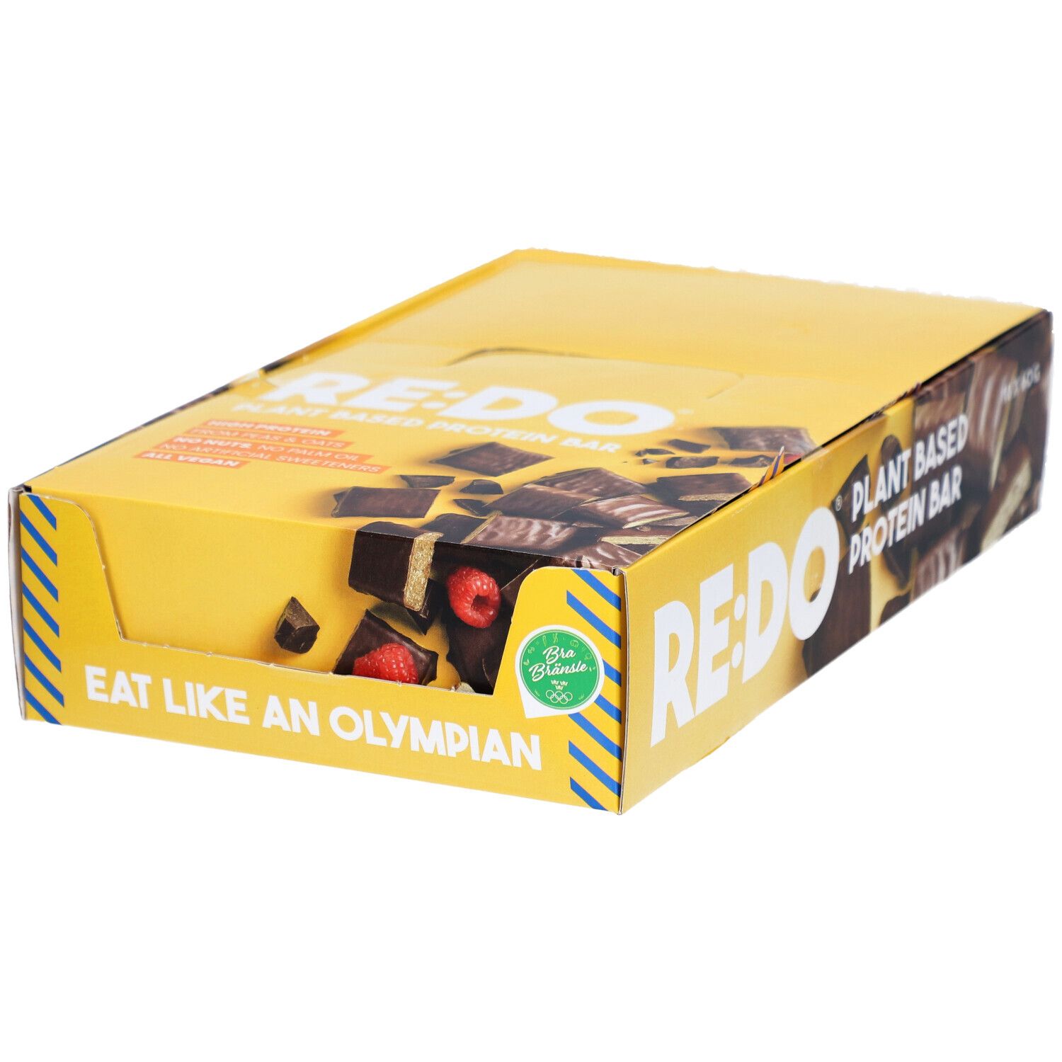 Boîte jaune avec logo RE:DO et texte. Montre des barres chocolatées avec des framboises. Inscription : Eat like an Olympian.