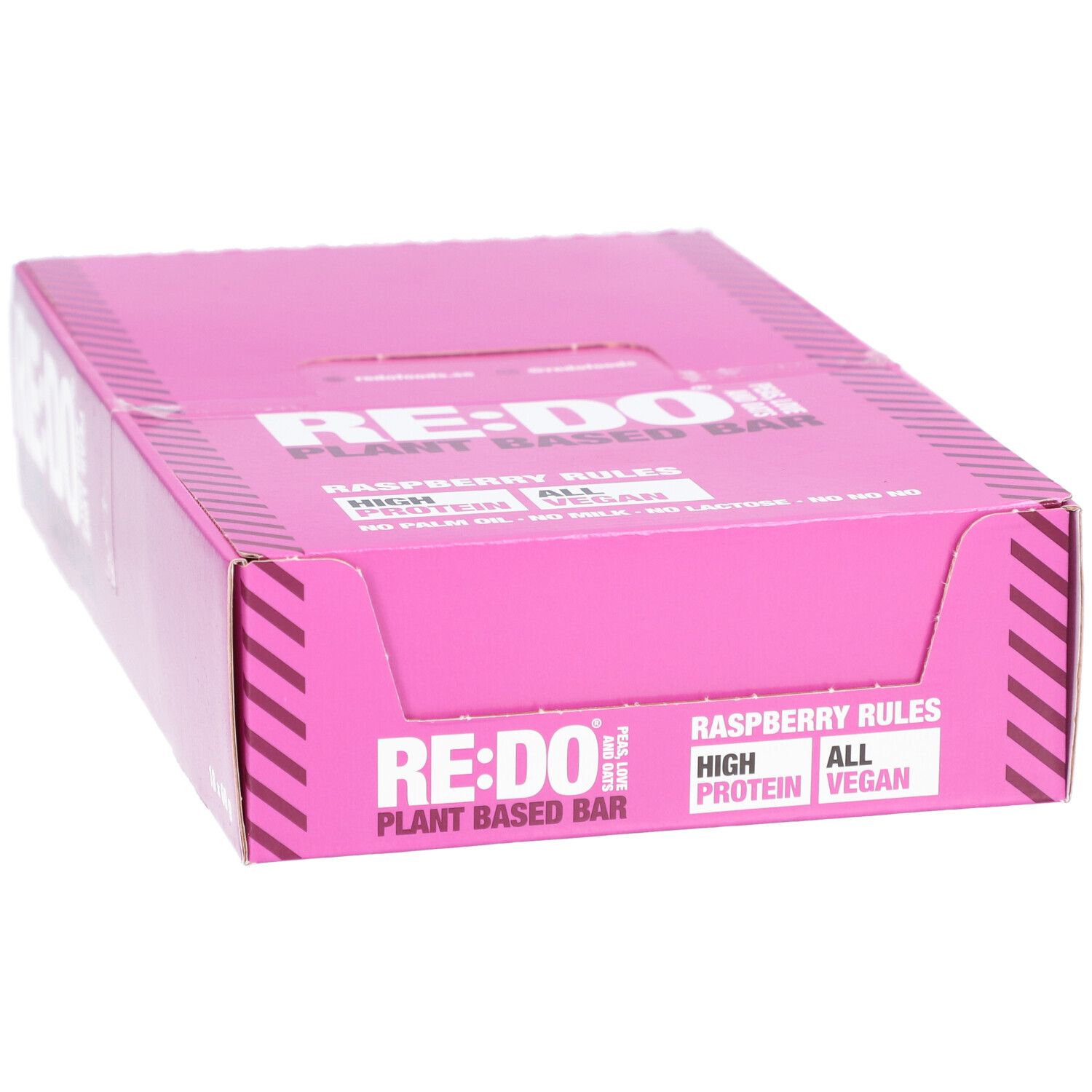 Boîte rose "RE:DO" avec "Raspberry Rules". Contient "High Protein" et "Vegan". Emballage de barres protéinées.