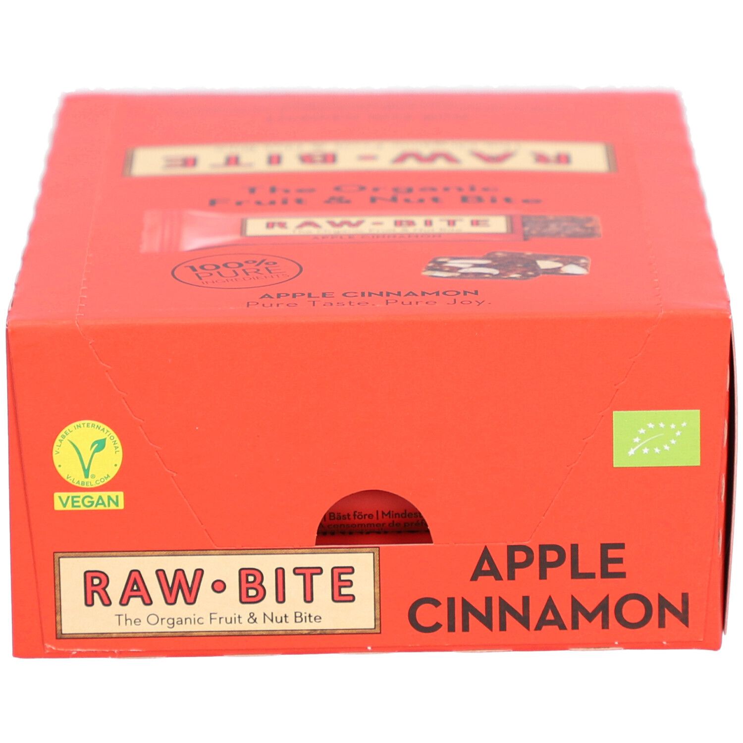 Boîte rouge avec logo "RAW BITE" et texte "APPLE CINNAMON". Label Vegan.