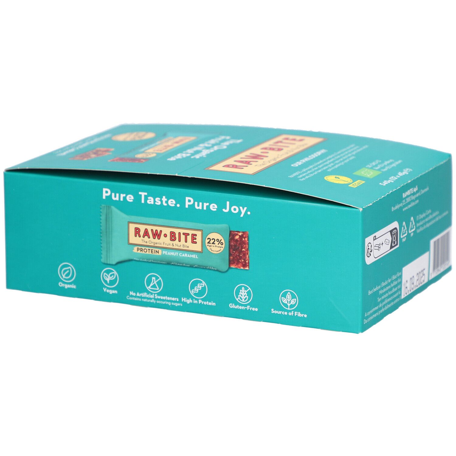 Boîte turquoise avec barres RAWBITE Protein Peanut Caramel. Label Vegan, 22% de protéines. Inscription: Pure Taste. Pure Joy. Sans gluten.