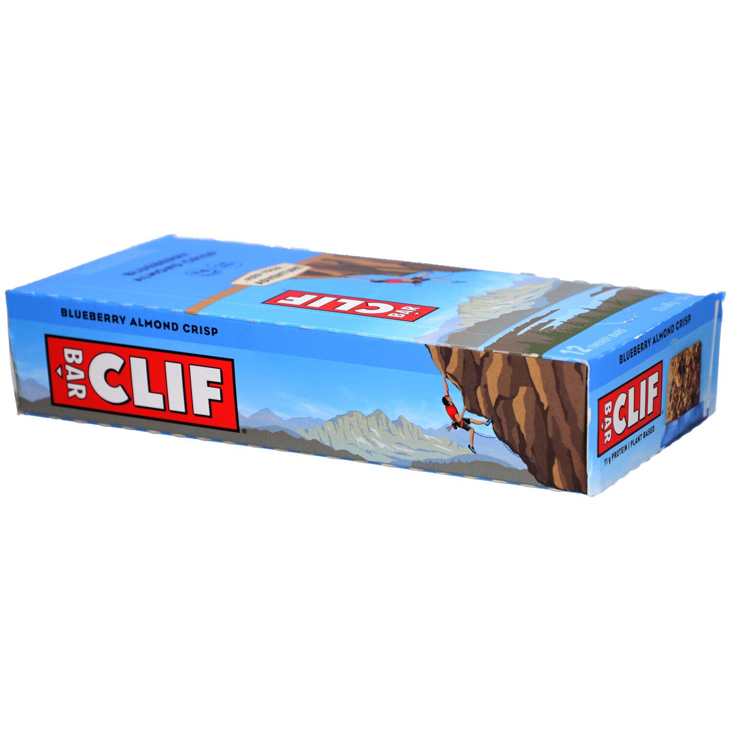 Emballage bleu et blanc CLIF Bar. Inscription Blueberry Almond Crisp. Paysage en arrière-plan.