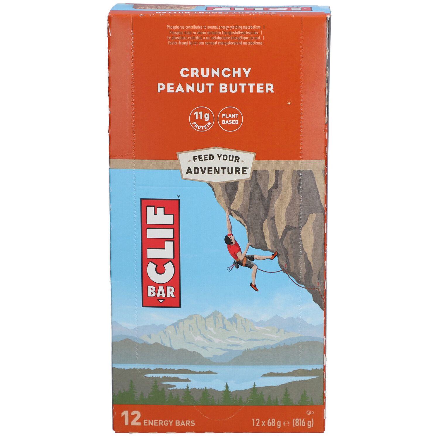 Vue de face de l'emballage Clif Bar Crunchy Peanut Butter. Montre le produit et une illustration d'un grimpeur.