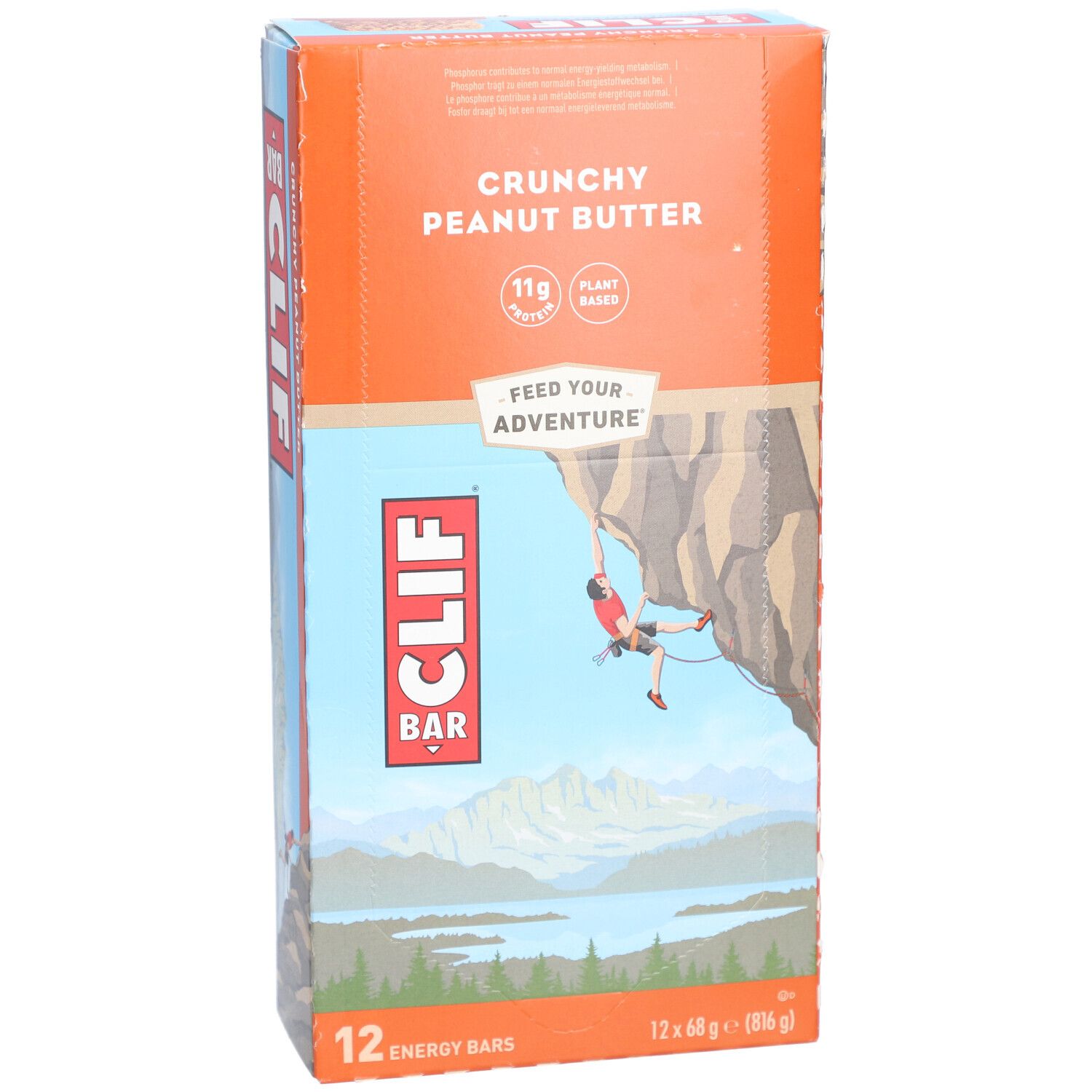 Vue de face de l'emballage Clif Bar Crunchy Peanut Butter. Montre le produit et une illustration d'un grimpeur.