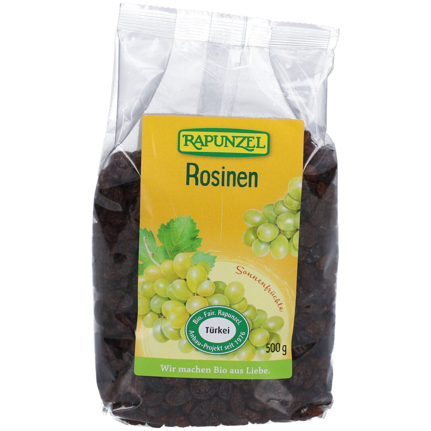 Sachet transparent de raisins secs RAPUNZEL. Étiquette jaune avec logo, texte et illustration de raisins. 500g.