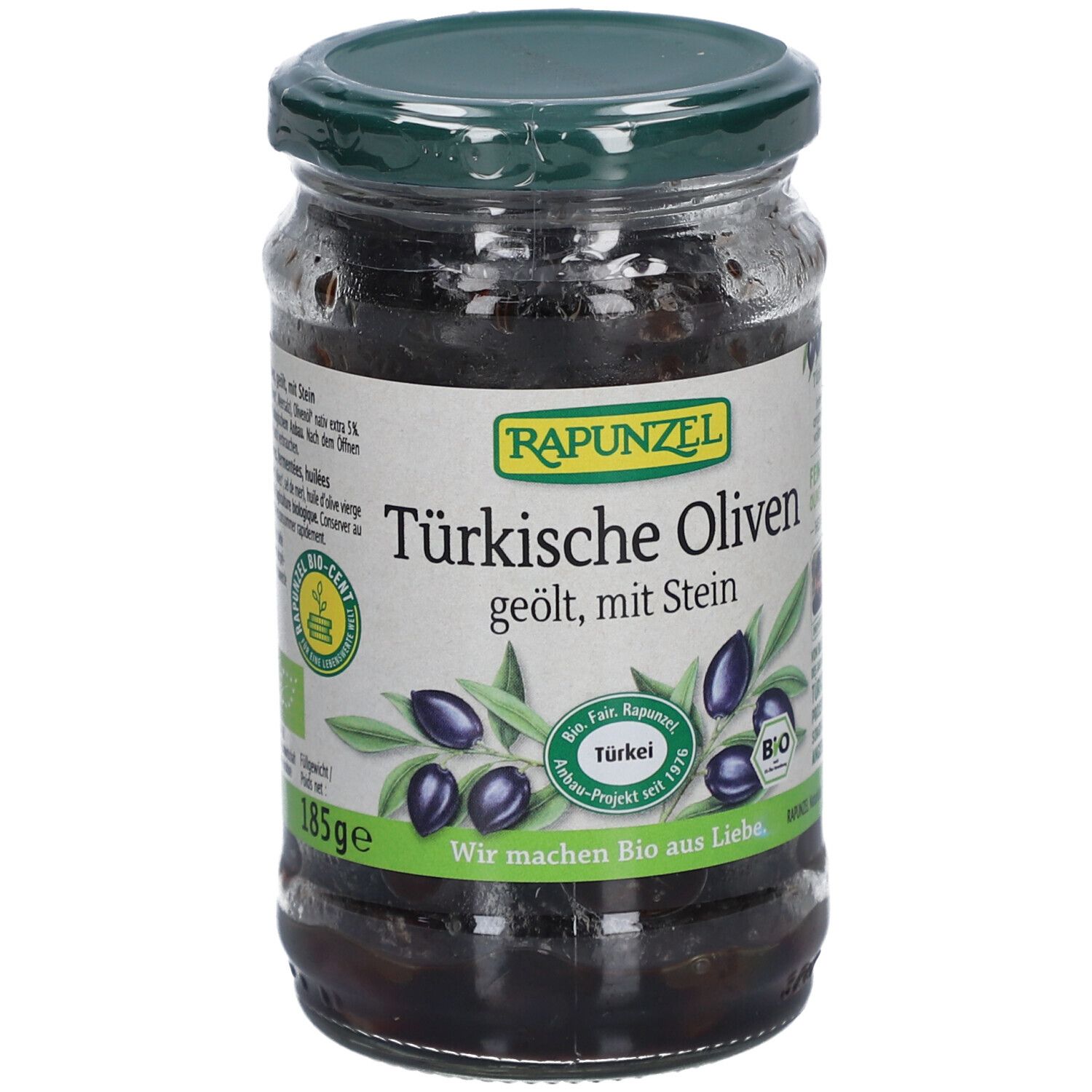 Bocal d'olives noires, huilées, avec noyau. Inscription : Olives turques, Rapunzel. Label bio. 185g.