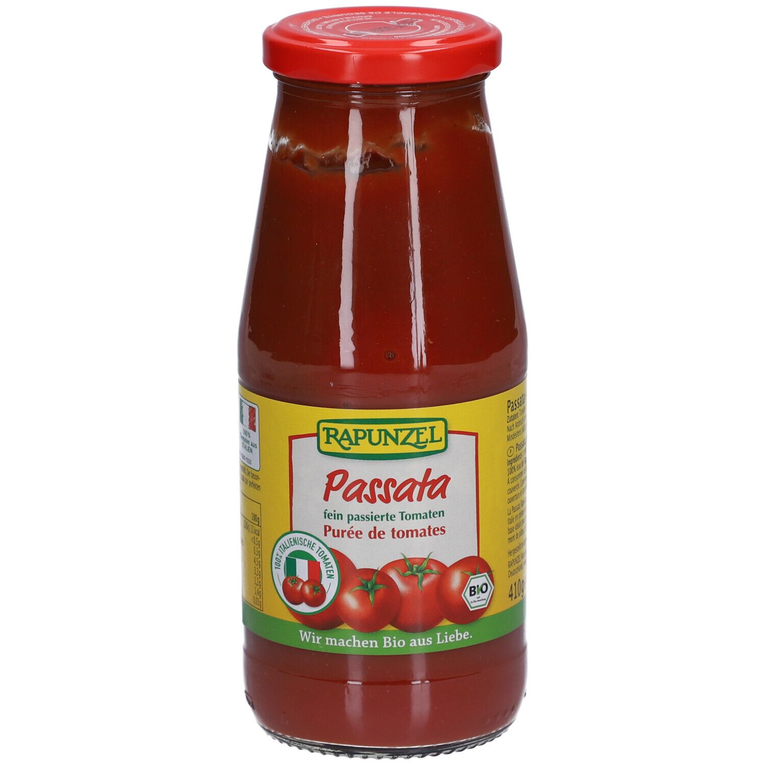 Bouteille en verre de passata. Étiquette avec "Rapunzel Passata", illustrations de tomates et label bio.