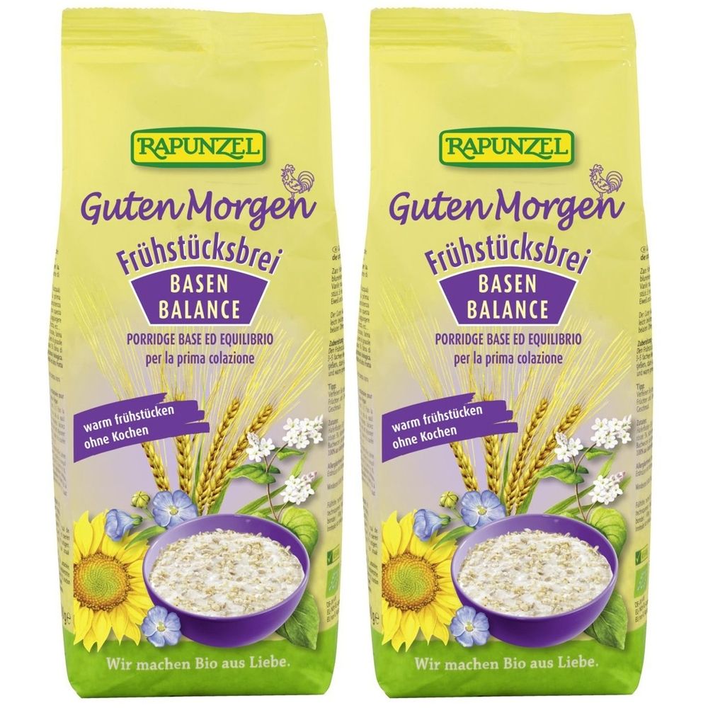 Deux paquets de RAPUNZEL Frühstücksbrei. Inscription : Guten Morgen Frühstücksbrei, Basen Balance. Illustration de céréales, fleurs et un bol de porridge.