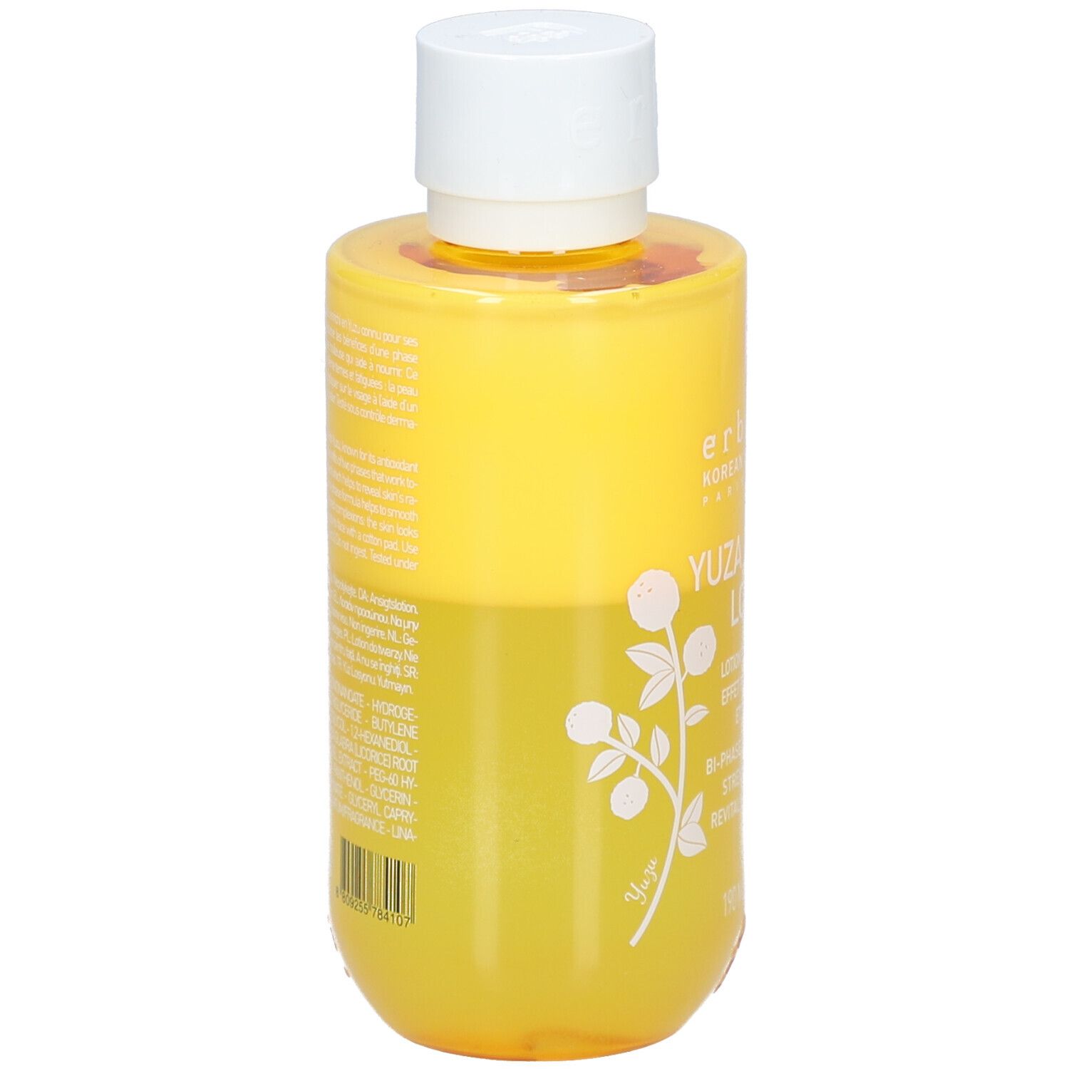 Flacon jaune avec bouchon blanc. Texte au dos. Yuza Double Lotion.