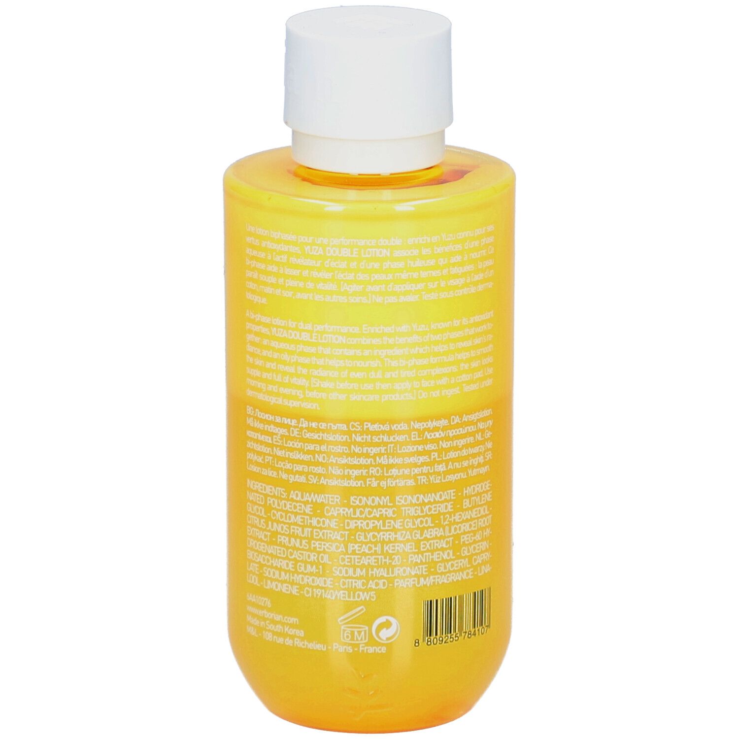 Flacon jaune avec bouchon blanc. Texte au dos. Yuza Double Lotion.