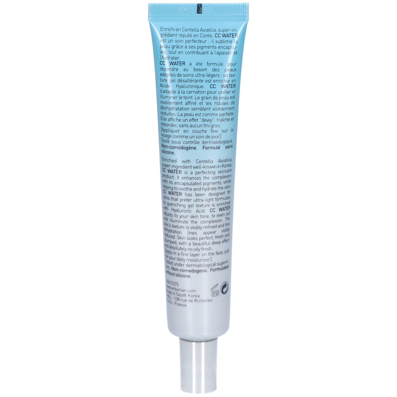 Dos du tube bleu clair. Texte multilingue. Ingrédients, informations fabricant et logo.
