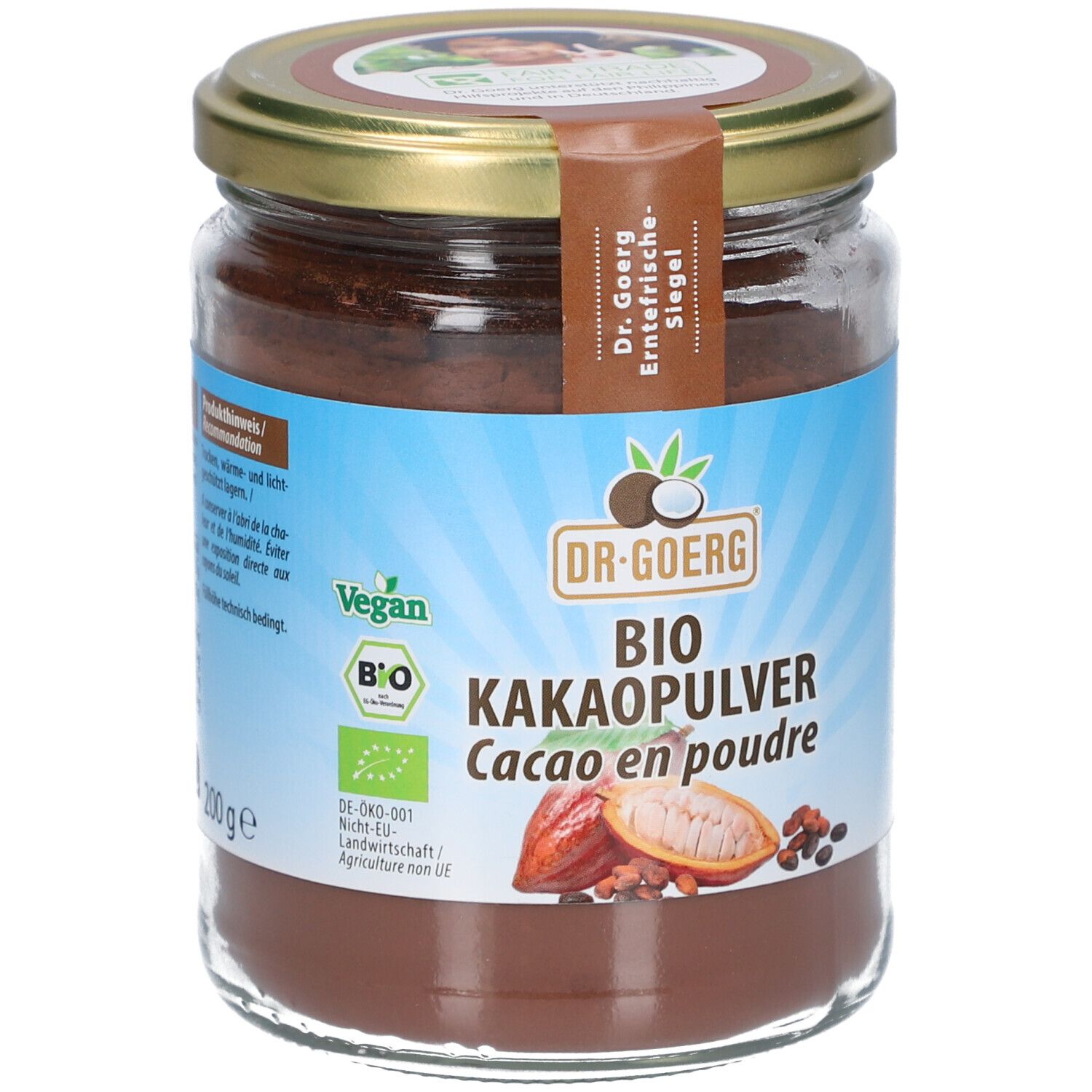 Pot en verre avec poudre brune. Étiquette "DR. GOERG BIO KAKAOPULVER". Labels Vegan et Bio.