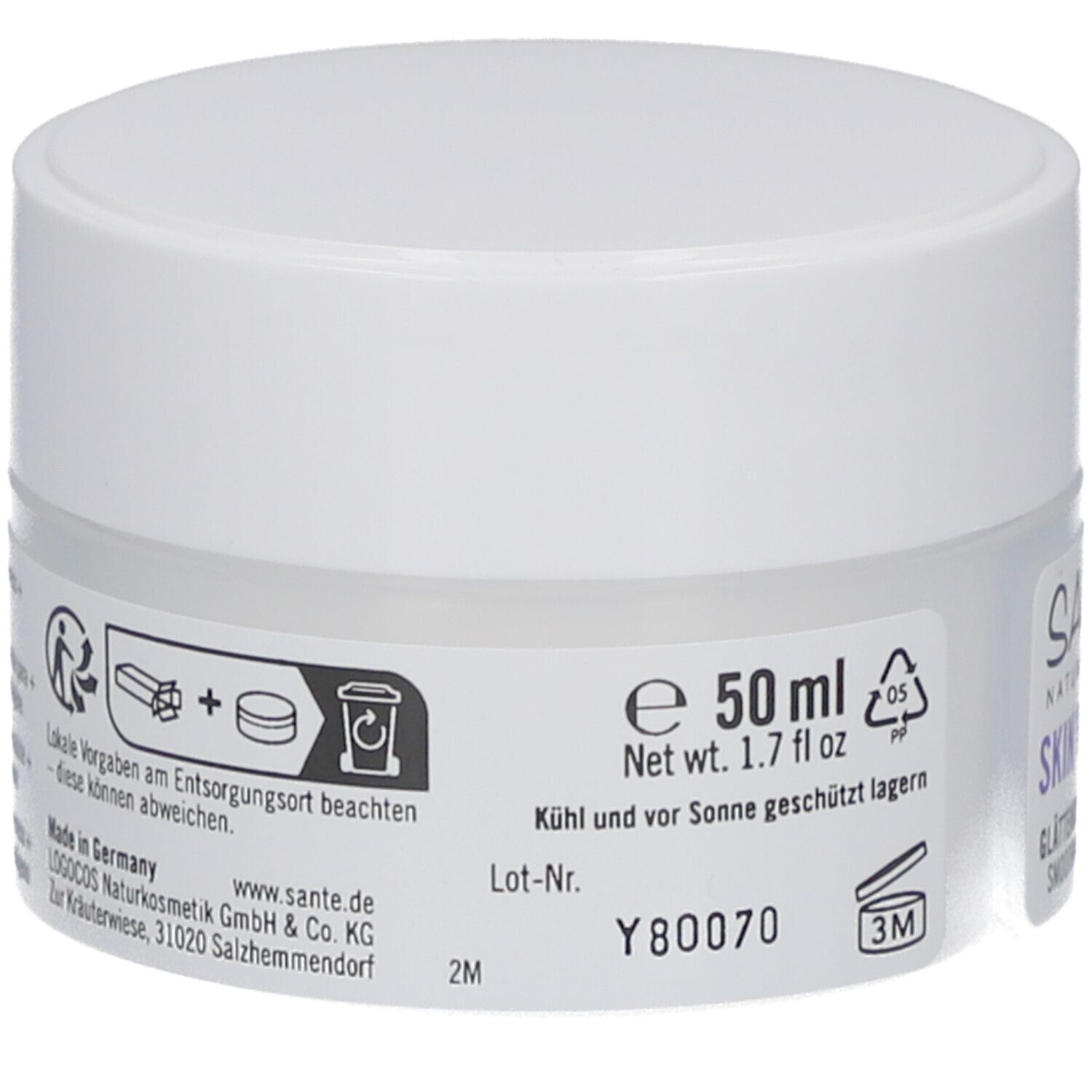 Pot de crème, couvercle blanc. Inscription : 50 ml, 1.7 fl oz. Informations sur l'élimination et la durabilité. Fabricant : Logocos Naturkosmetik.