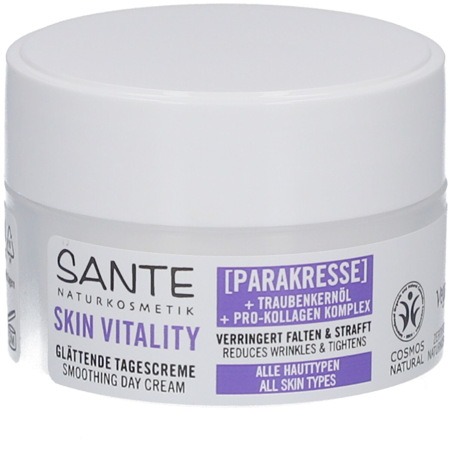 Pot de crème avec couvercle blanc. Inscription : Sante Skin Vitality Crème de jour lissante. Contient para-cresson et huile de pépins de raisin. Label Cosmos Natural.