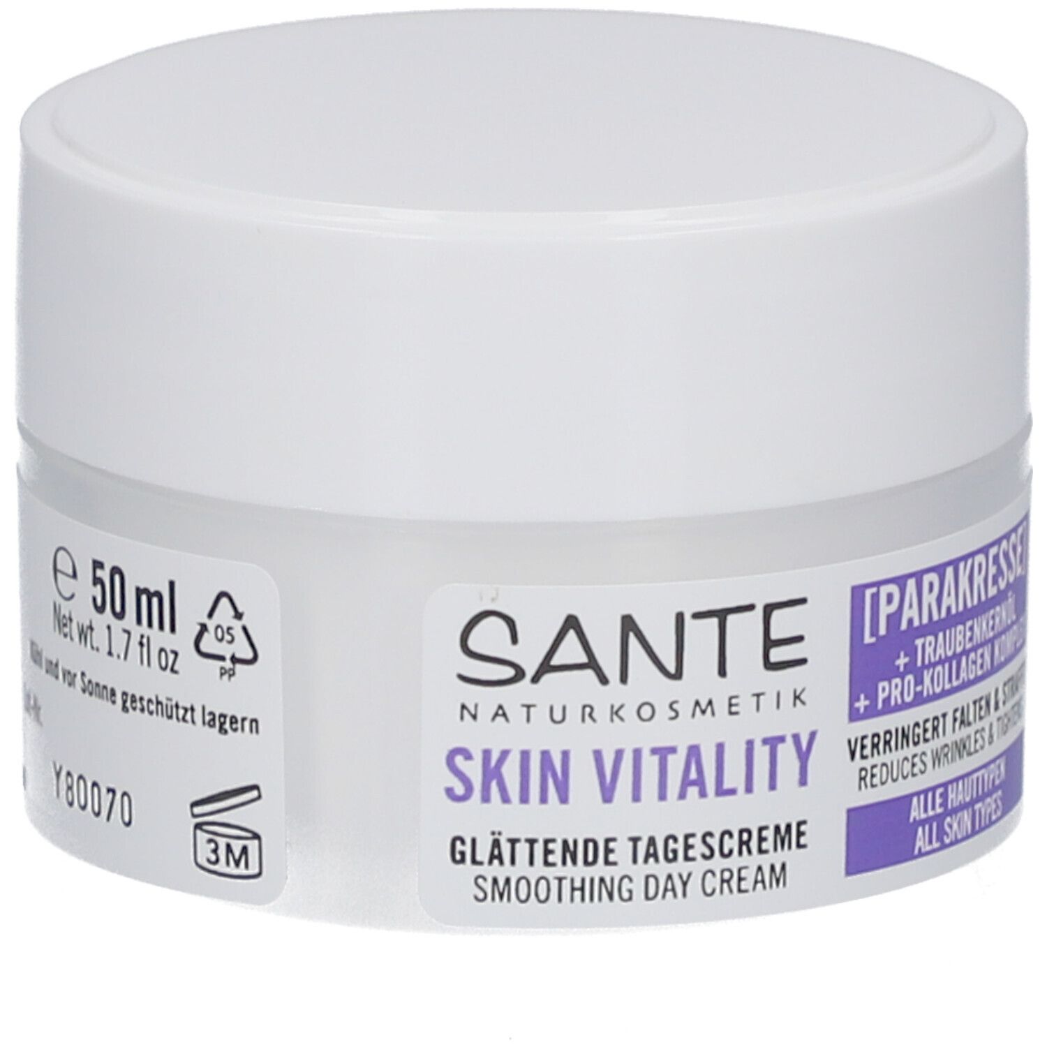 Pot de crème avec couvercle blanc. Inscription : Sante Skin Vitality Crème de jour lissante. Contient para-cresson et huile de pépins de raisin. 50 ml.