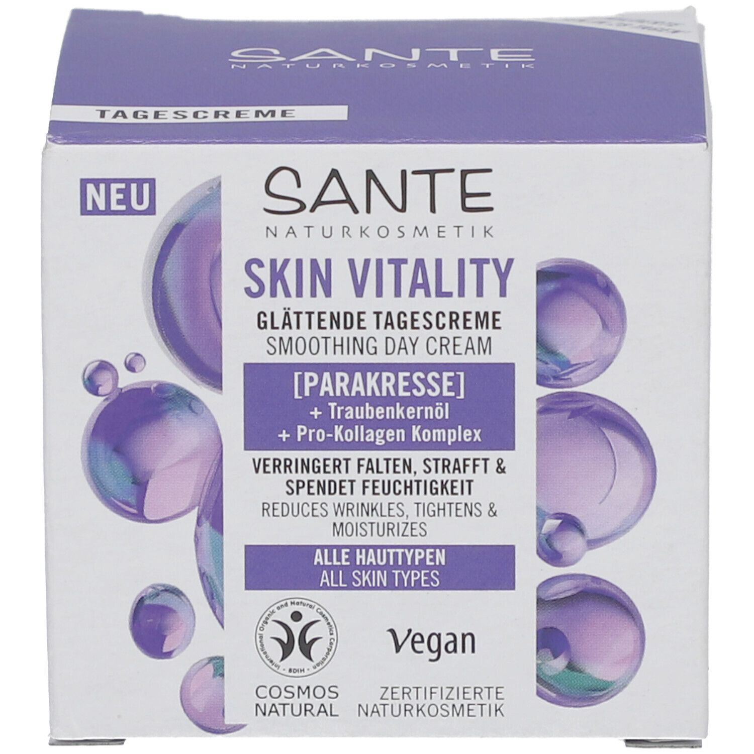 Emballage du produit. Inscription : Sante Skin Vitality Crème de jour lissante. Contient para-cresson et huile de pépins de raisin. Vegan. Label Cosmos Natural.