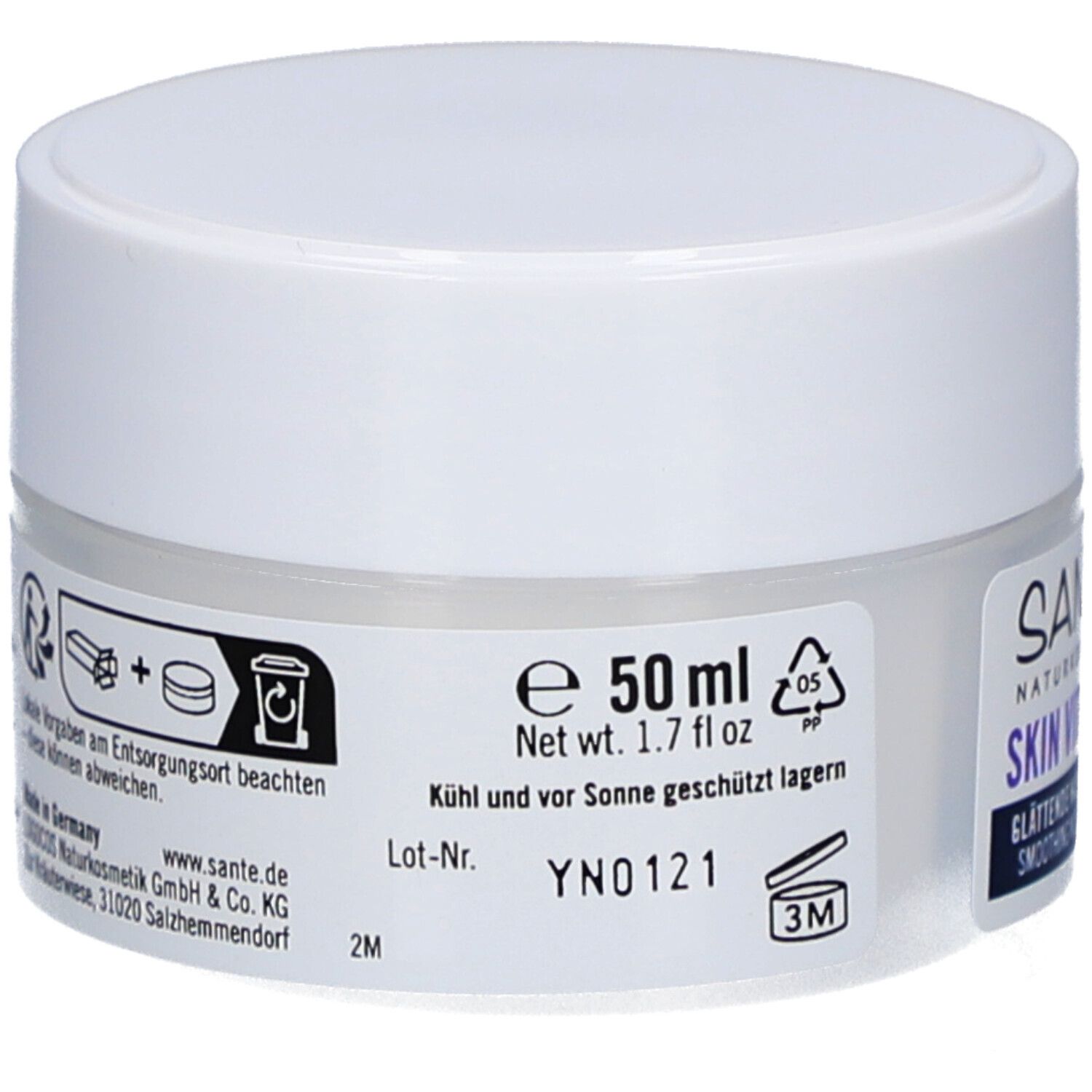 Pot de crème blanc. Informations au dos. 50 ml. Symbole de durabilité. Fabriqué en Allemagne.