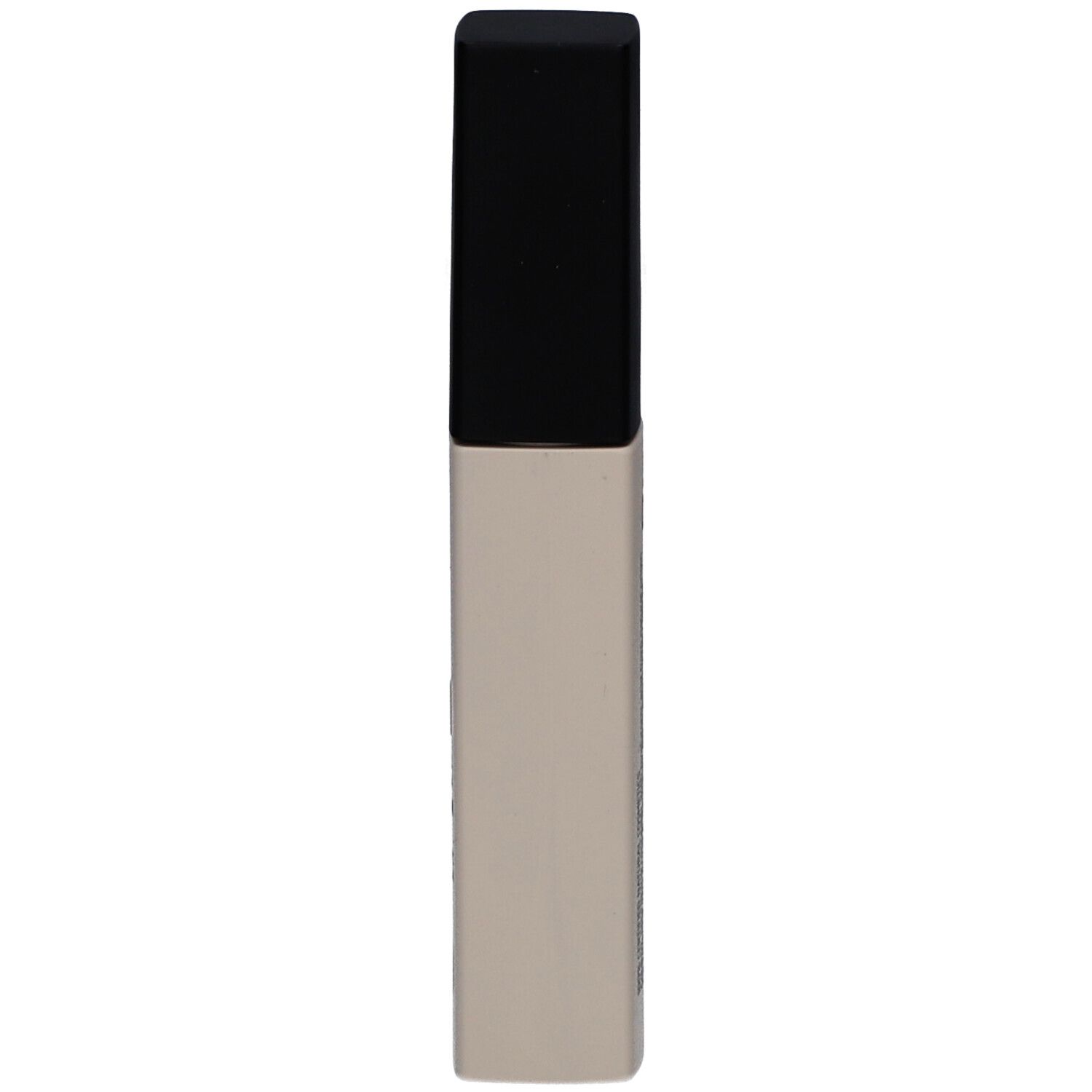 Tube de correcteur beige à bouchon noir. Aucun autre détail visible.