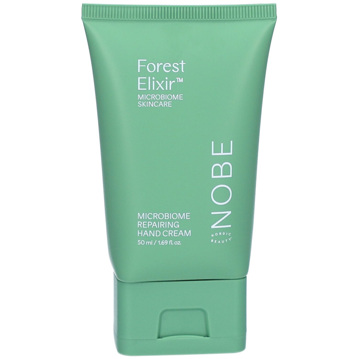 Tube verte de crème pour les mains. Texte: Forest Elixir, Mikrobiom Skincare, Mikrobiom Reparierende Handcreme. Marque NOBE.