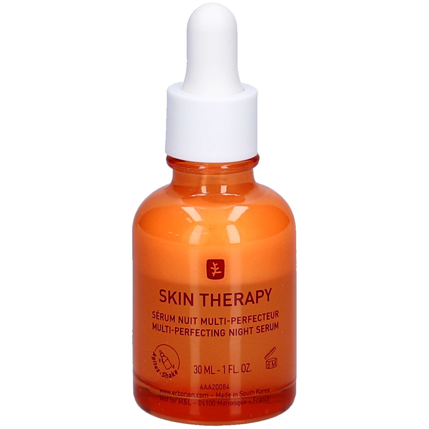 Flacon en verre orange avec bouchon et pipette blancs. Inscription: Skin Therapy Sérum Nuit Multi-Perfecteur.