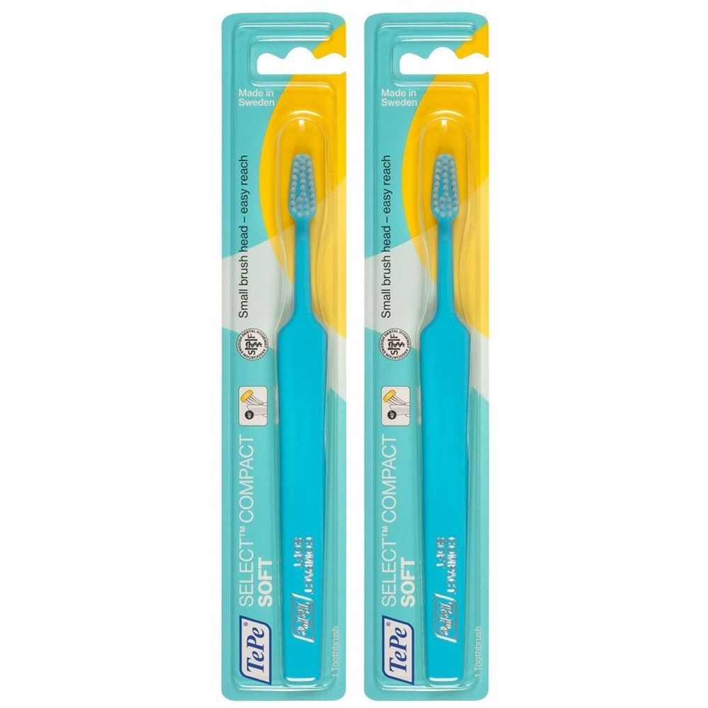 Deux brosses à dents emballées. Manches turquoise, emballage jaune. Inscription : TePe Select Compact Soft.