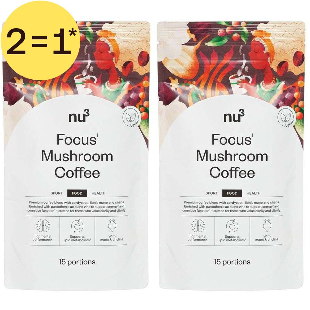 Deux paquets de nu3 Focus Mushroom Coffee avec 15 portions, avec un autocollant jaune '2=1*'. L'emballage présente des motifs végétaux.