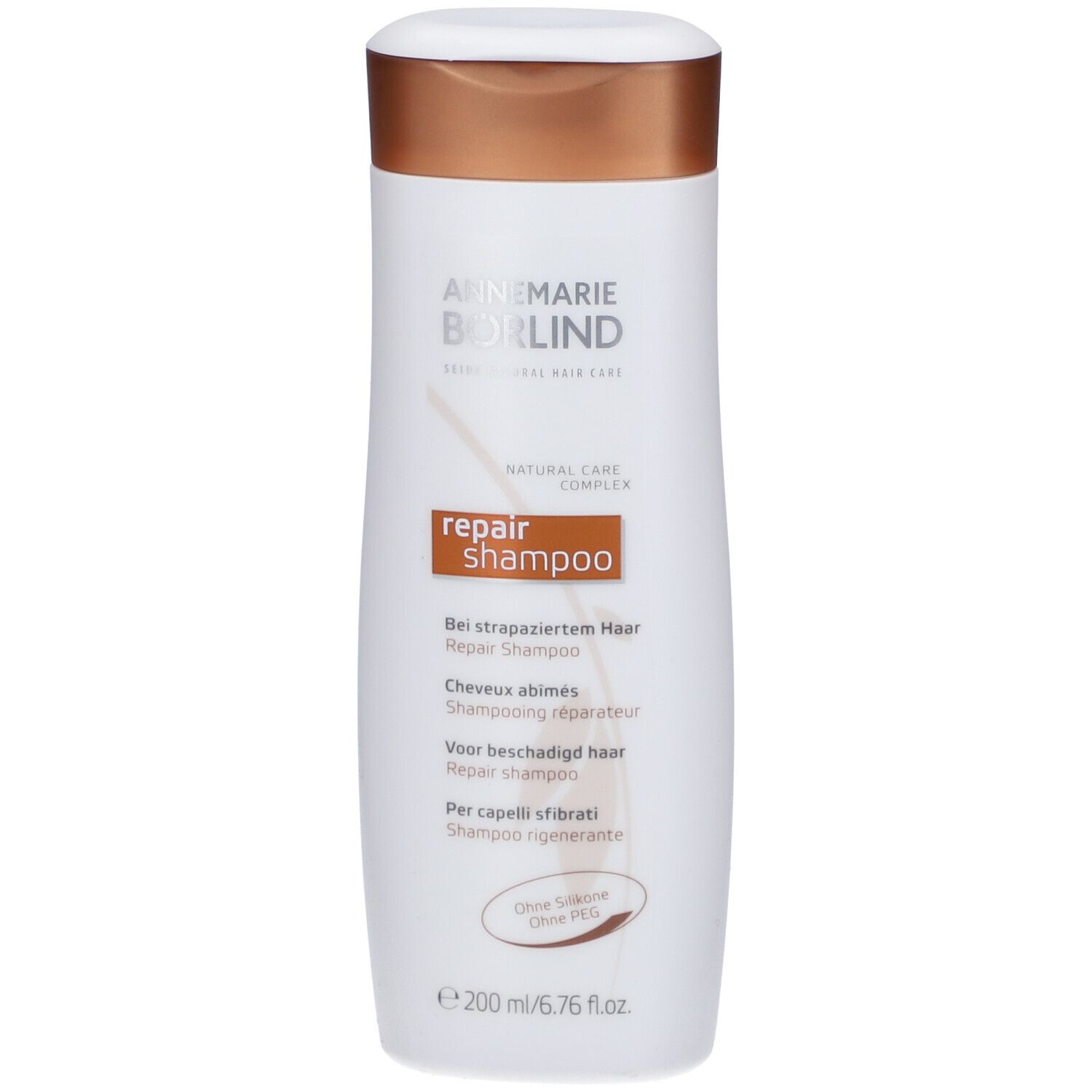Flacon blanc avec bouchon marron. Inscription: ANNEMARIE BÖRLIND Repair Shampoo. Texte multilingue. Volume: 200 ml.