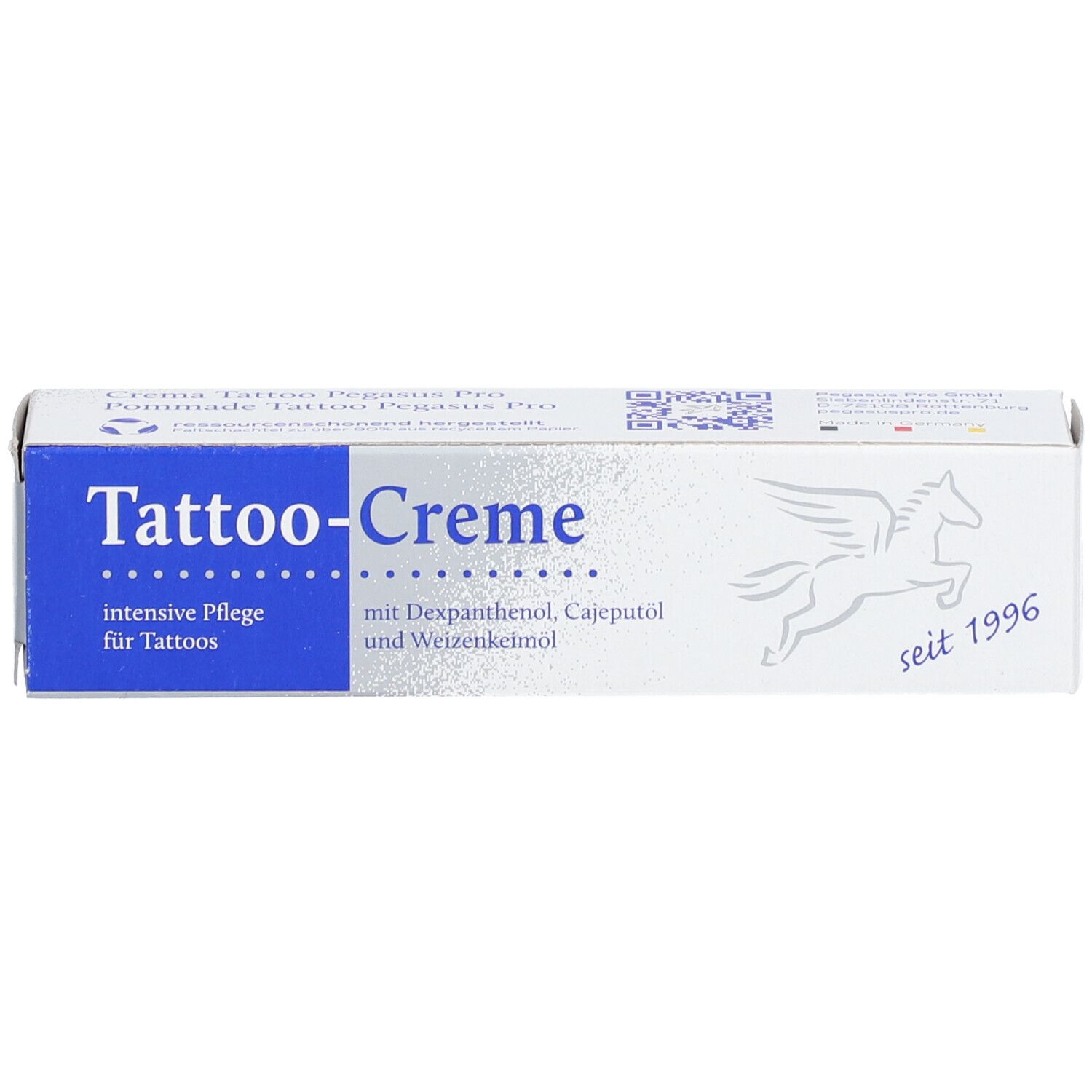Boîte de Tattoo-Creme avec zone bleue et logo. Contient dexpanthénol, huile de cajeput et huile de germe de blé. Depuis 1996. Soin intensif.