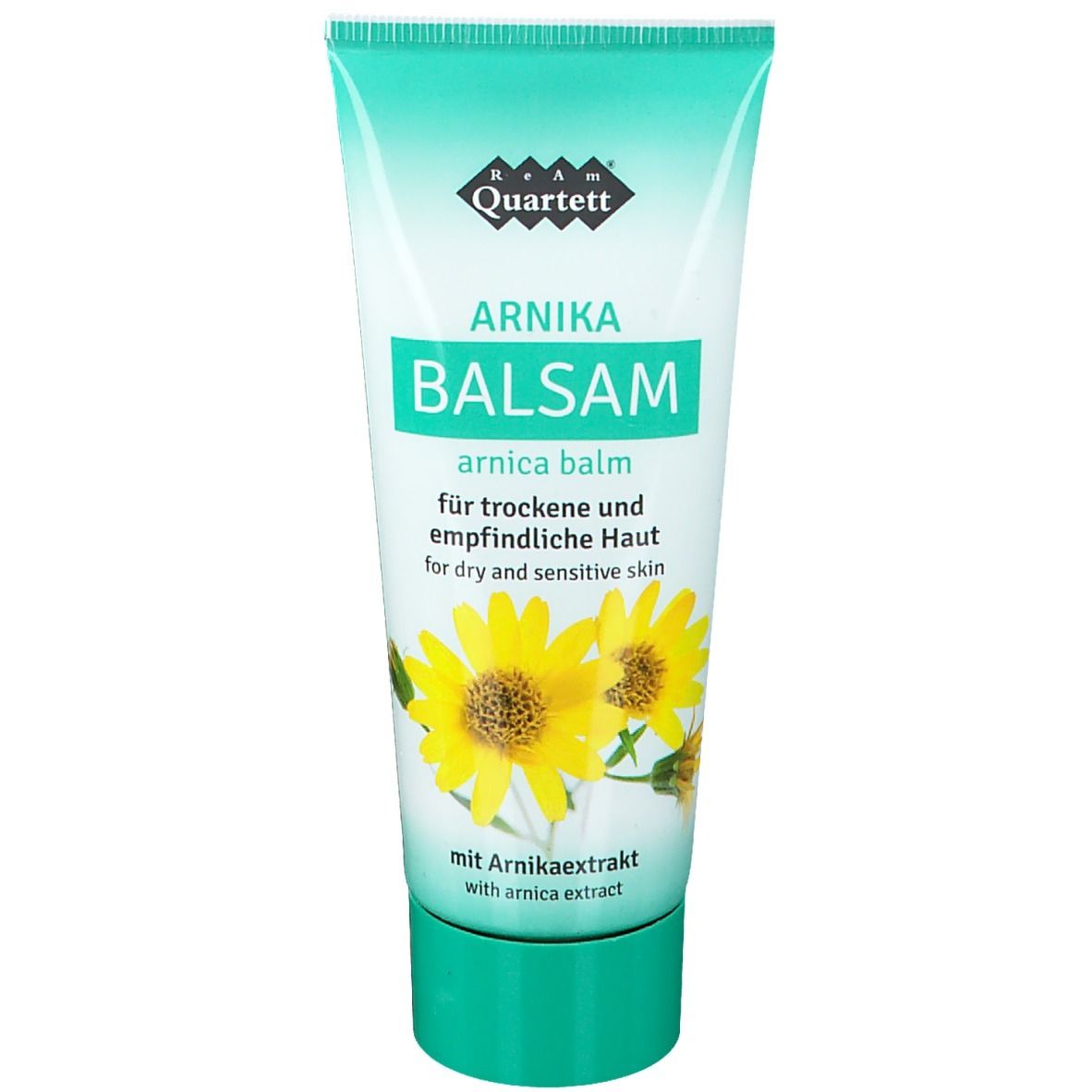 Tube de "ReAm Quartett Arnika Balsam". Design vert et blanc avec fleurs. Texte : "Arnika Balsam" et "pour peaux sèches et sensibles".