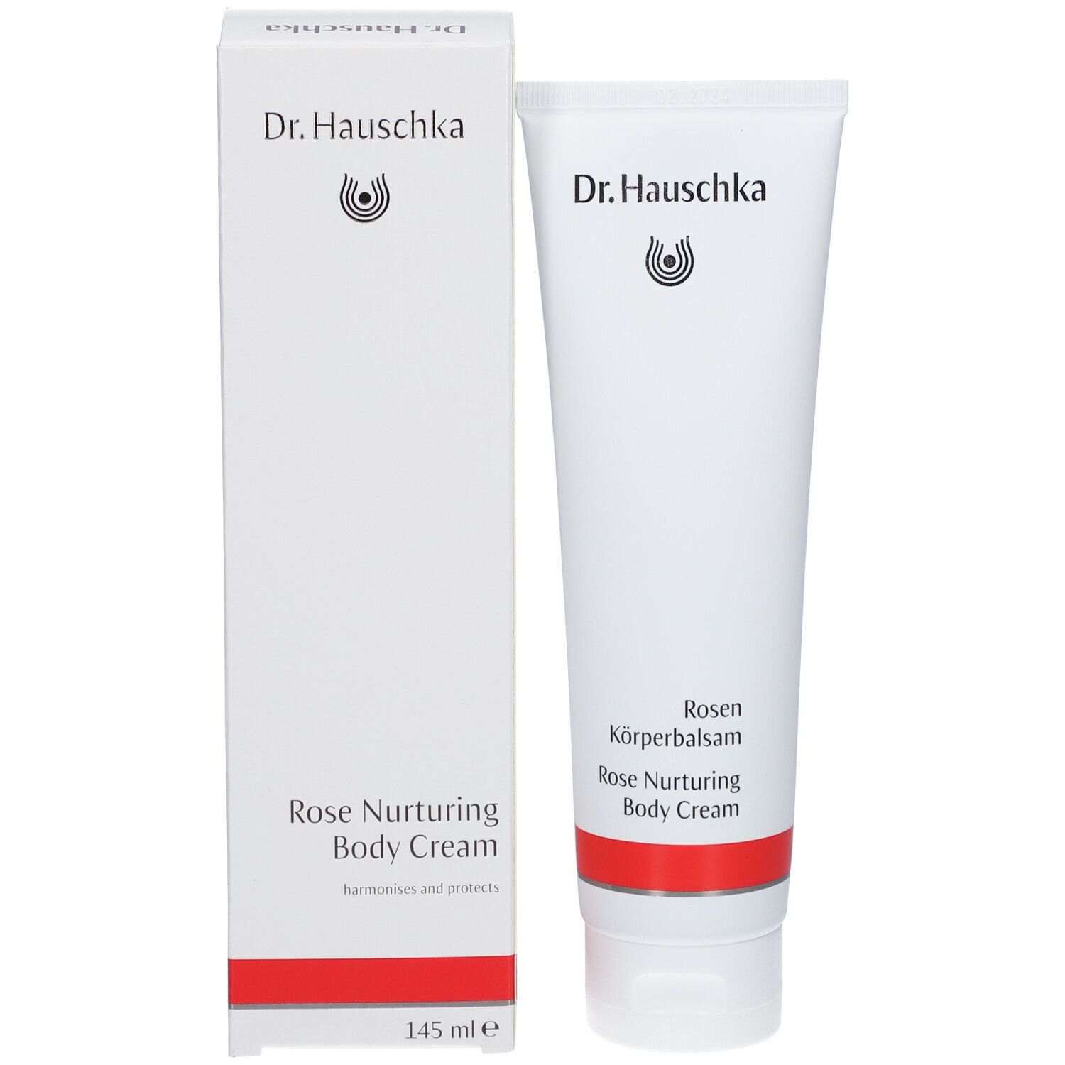 Tube et boîte blancs. Inscription: Dr. Hauschka, Rosen Körperbalsam, Rose Nurturing Body Cream. Bande rouge.