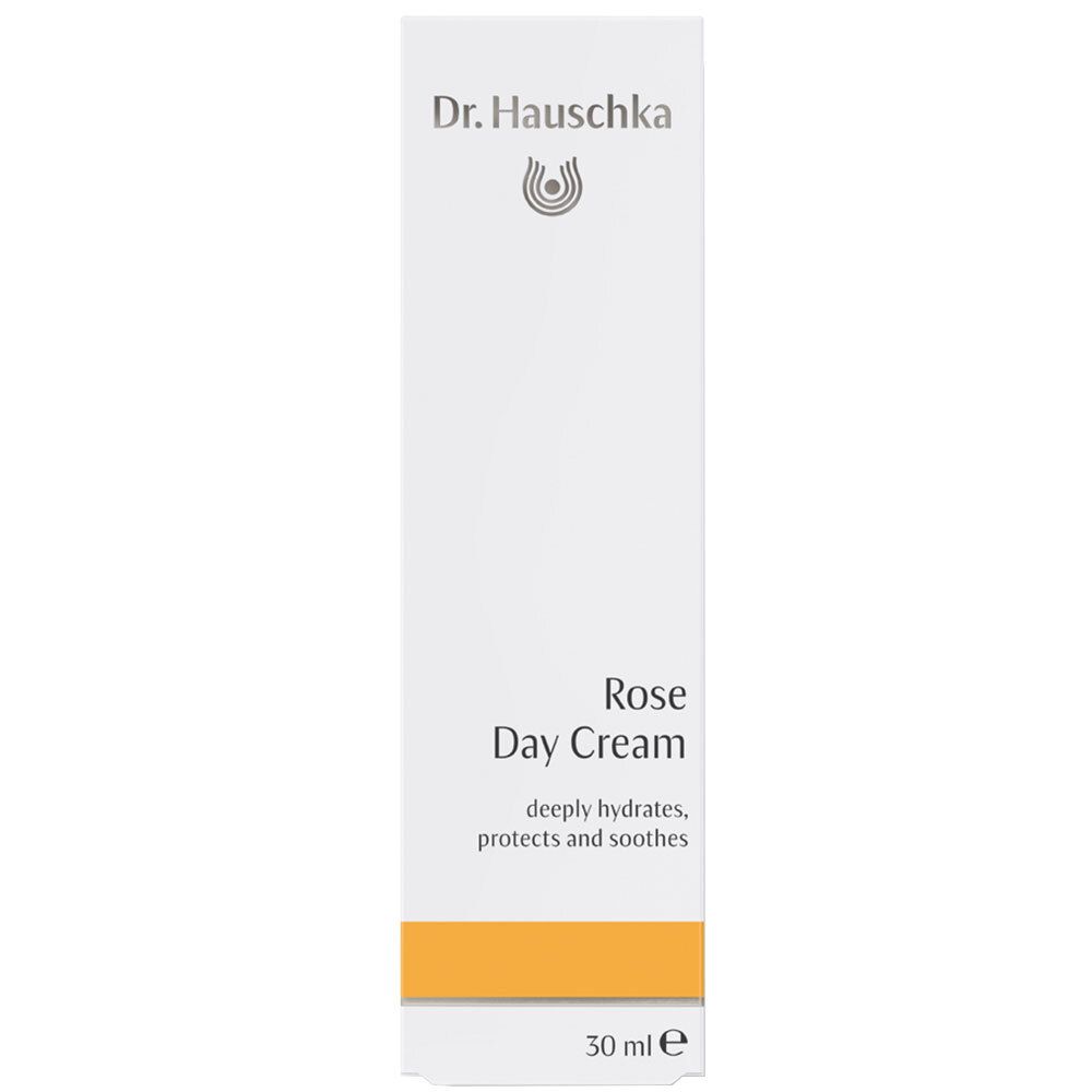 Boîte pliante blanche avec logo Dr. Hauschka, inscription Rosen Tagescreme et bande orange.